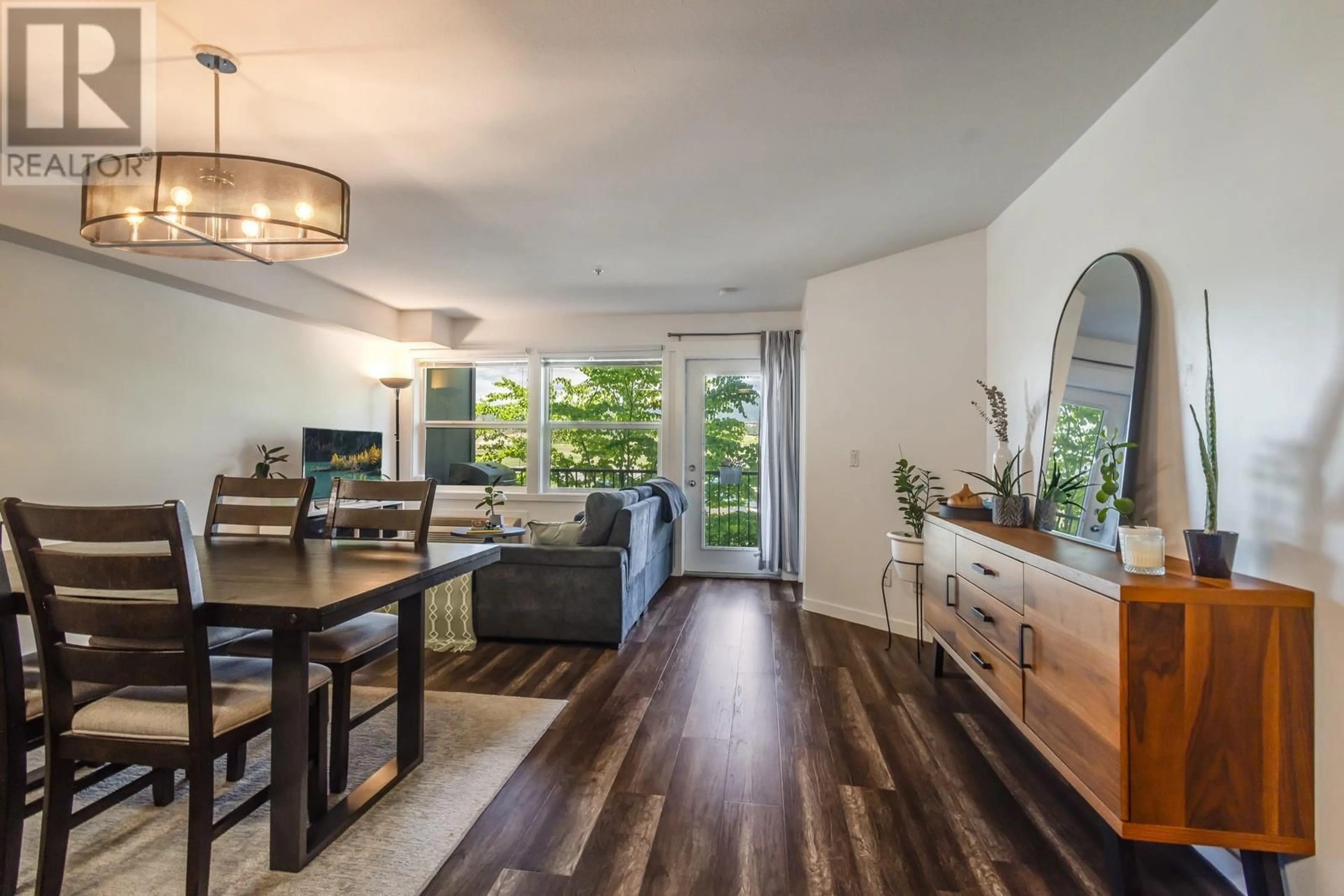 Living room with furniture, wood/laminate floor for 209 - 1479 GLENMORE ROAD NORTH, Kelowna British Columbia V1V2C5