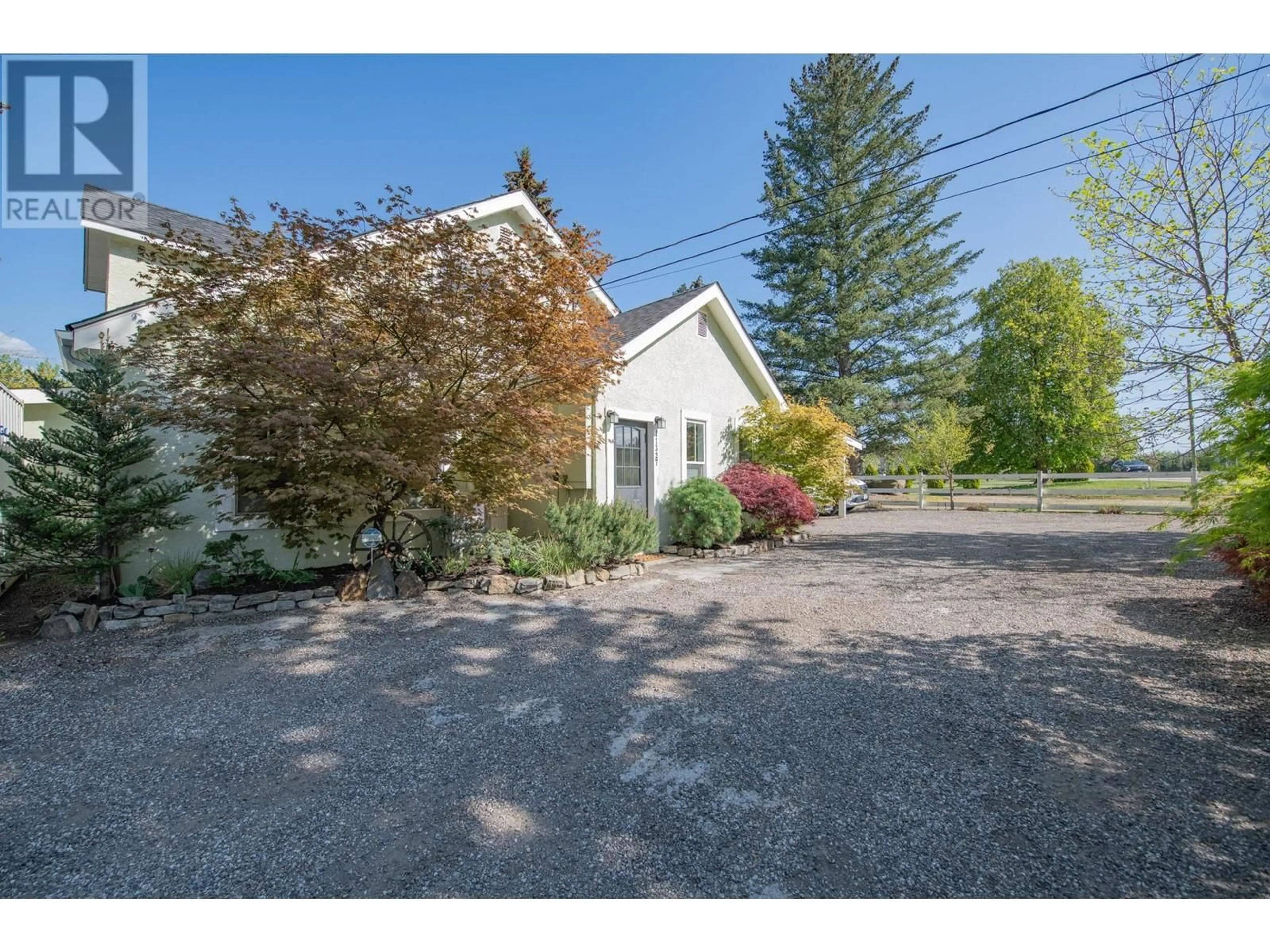 A pic from outside/outdoor area/front of a property/back of a property/a pic from drone, street for 11327 OKANAGAN CENTRE ROAD EAST, Lake Country British Columbia V4V1G7
