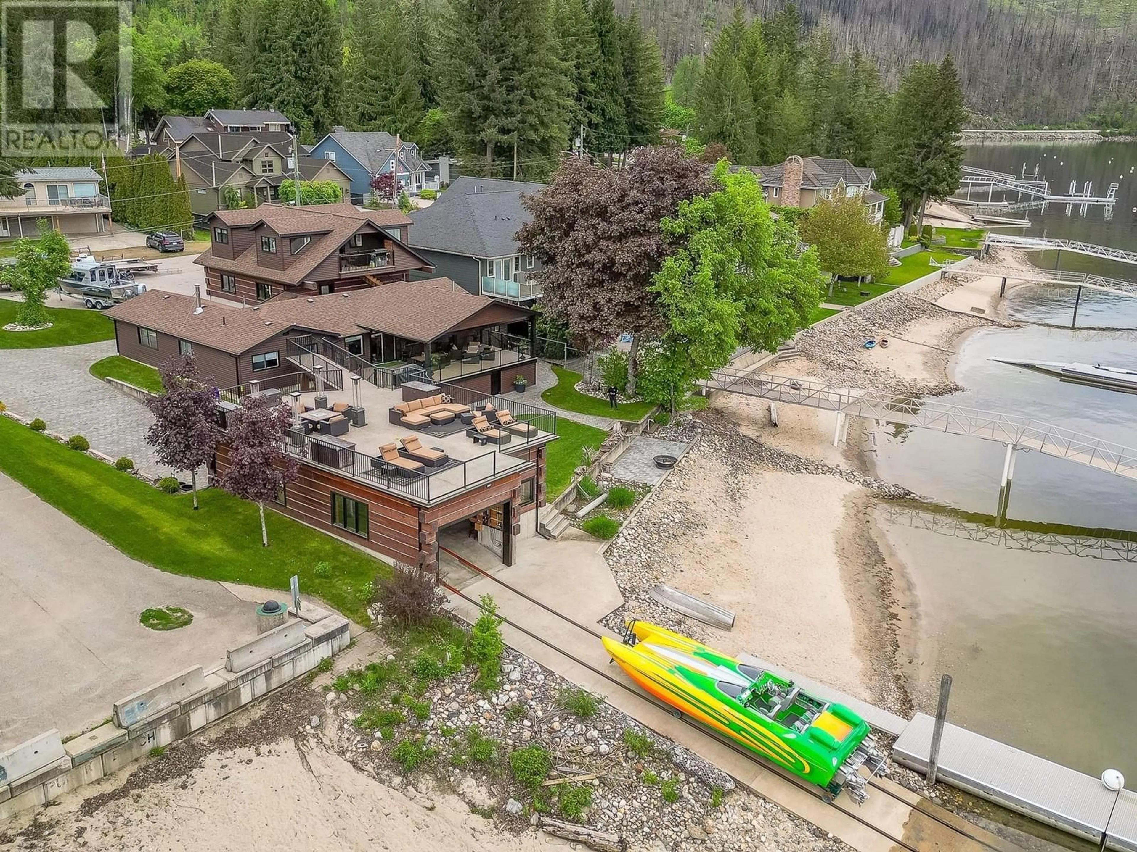 A pic from outside/outdoor area/front of a property/back of a property/a pic from drone, water/lake/river/ocean view for 78 MONTCALM CRESCENT, Sicamous British Columbia V0E2V1