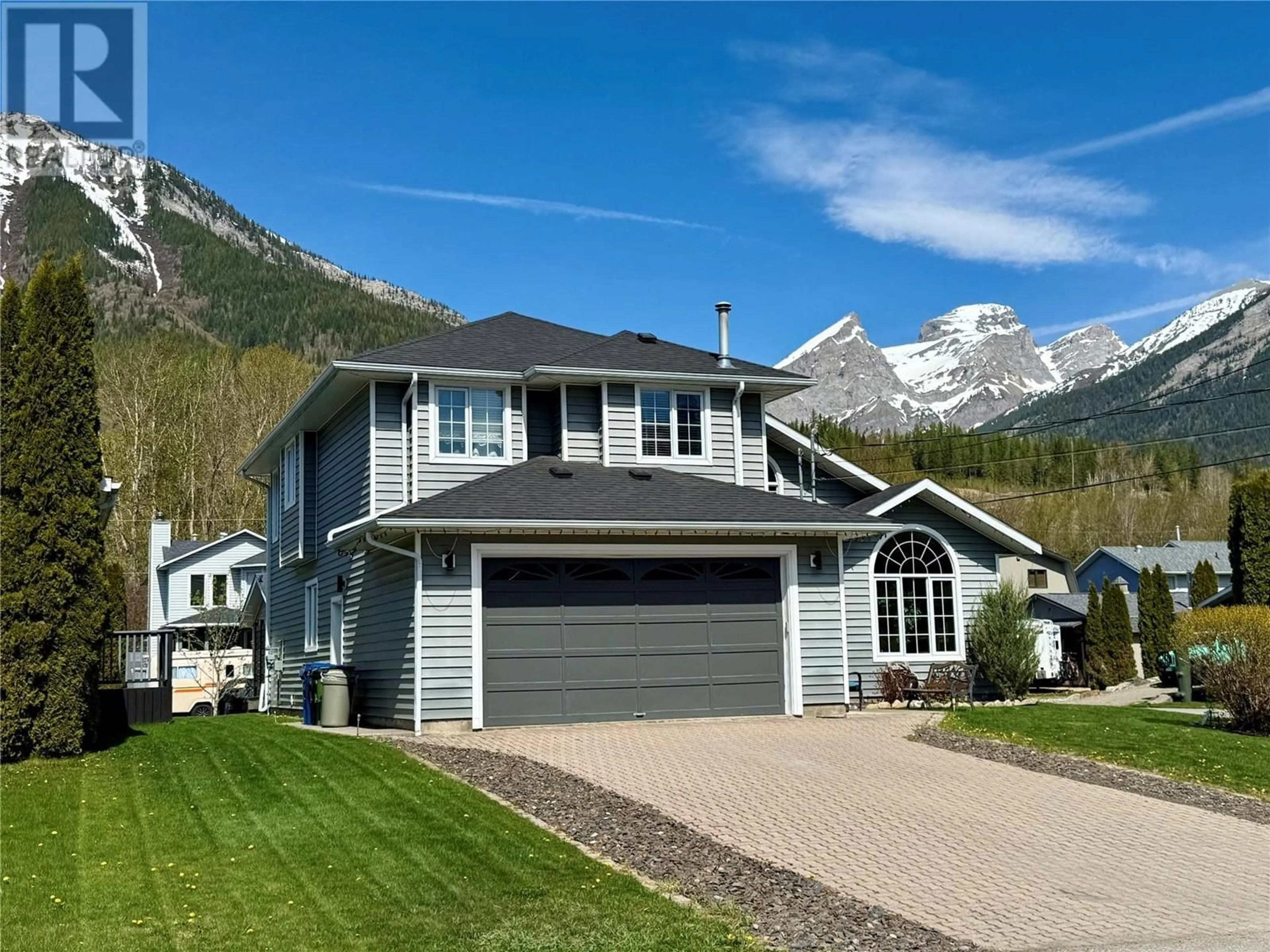Home with vinyl exterior material, mountain view for 1291 11TH AVENUE, Fernie British Columbia V0B1M0