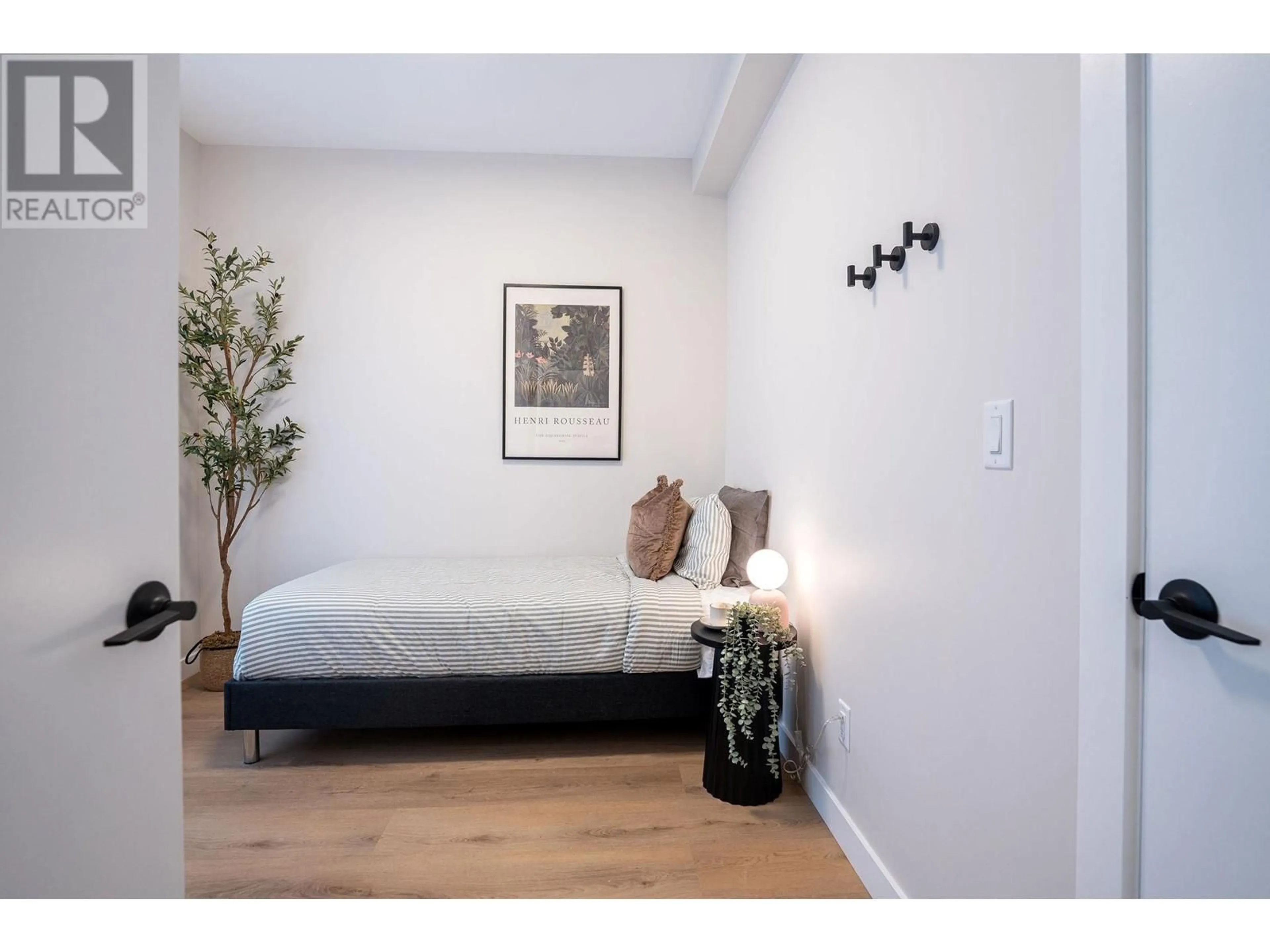 Bedroom with bed, wood/laminate floor for 1208 DOUGLAS STREET WEST, Revelstoke British Columbia V0E2S0