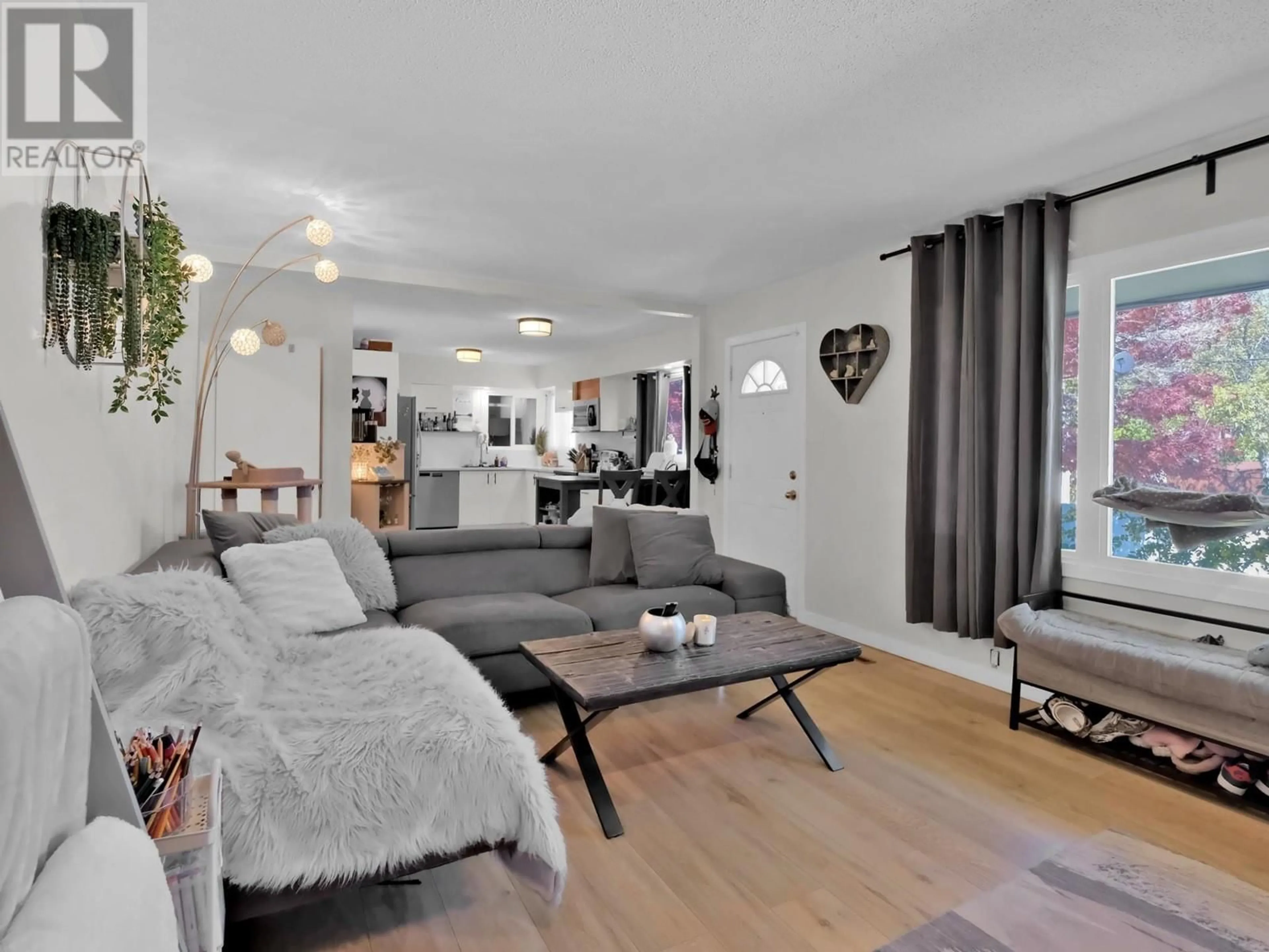 Living room with furniture, wood/laminate floor for 54 GRANBY AVENUE, Penticton British Columbia V2A2Y7