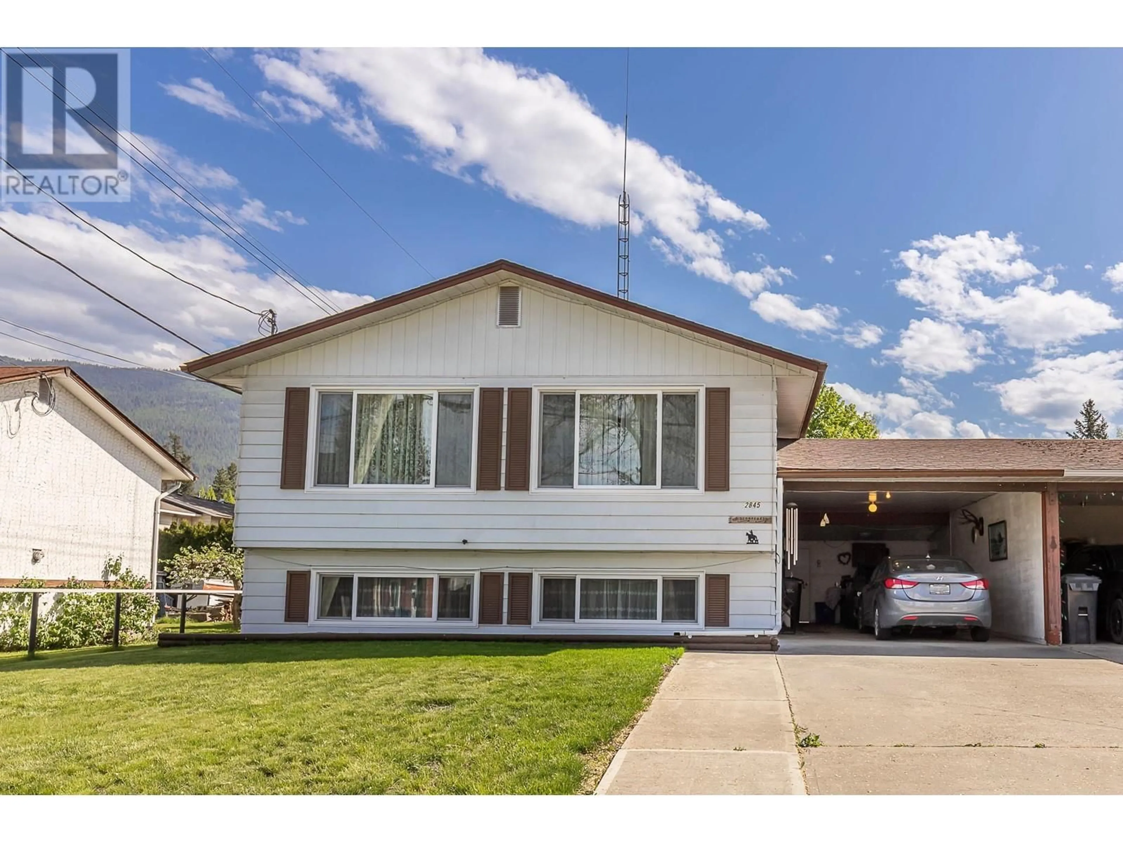 Home with vinyl exterior material, street for 2845 BURNS AVENUE, Armstrong British Columbia V0E1B2