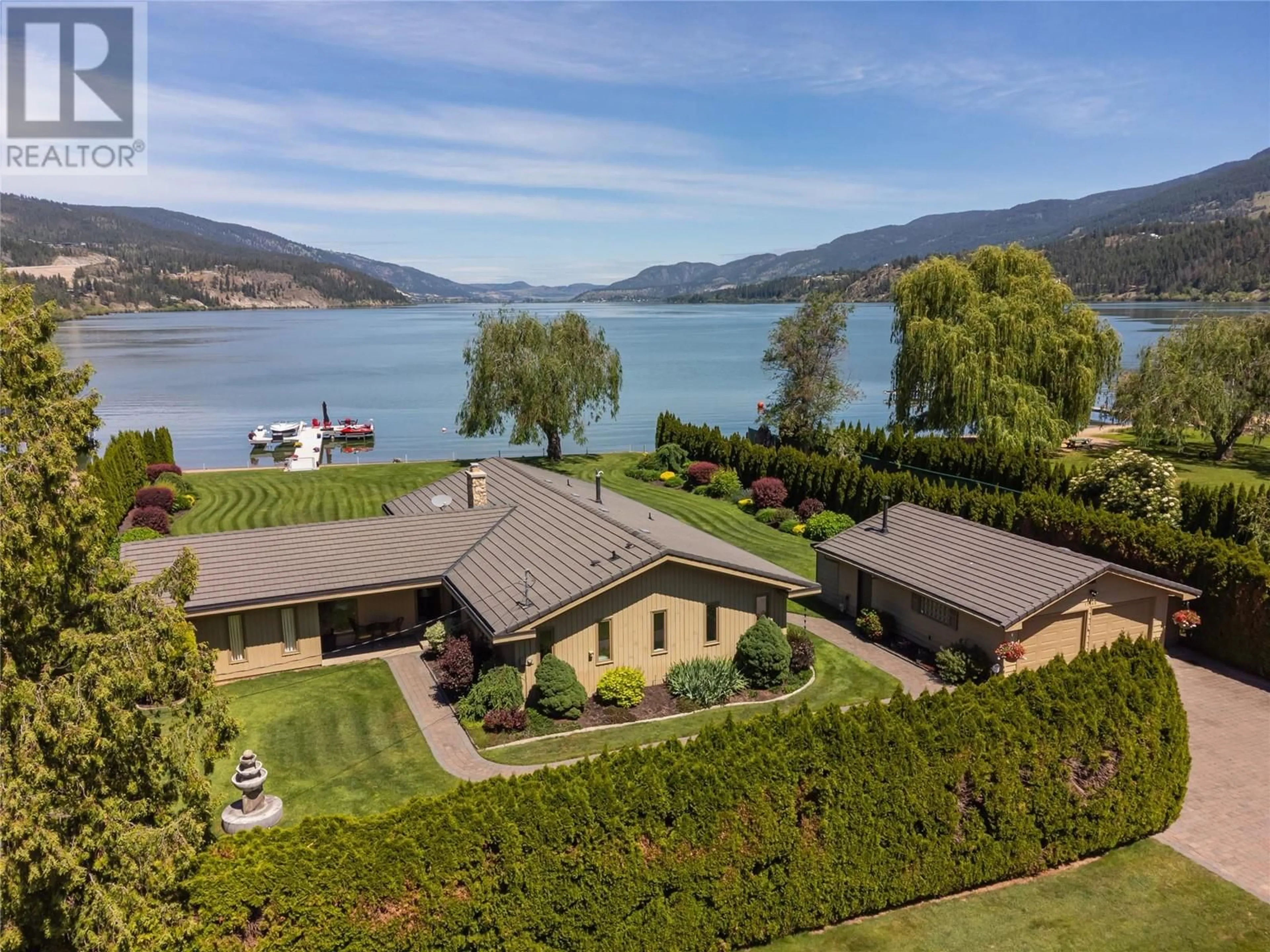 A pic from outside/outdoor area/front of a property/back of a property/a pic from drone, water/lake/river/ocean view for 11640 ROGERS ROAD, Lake Country British Columbia V4V1X8