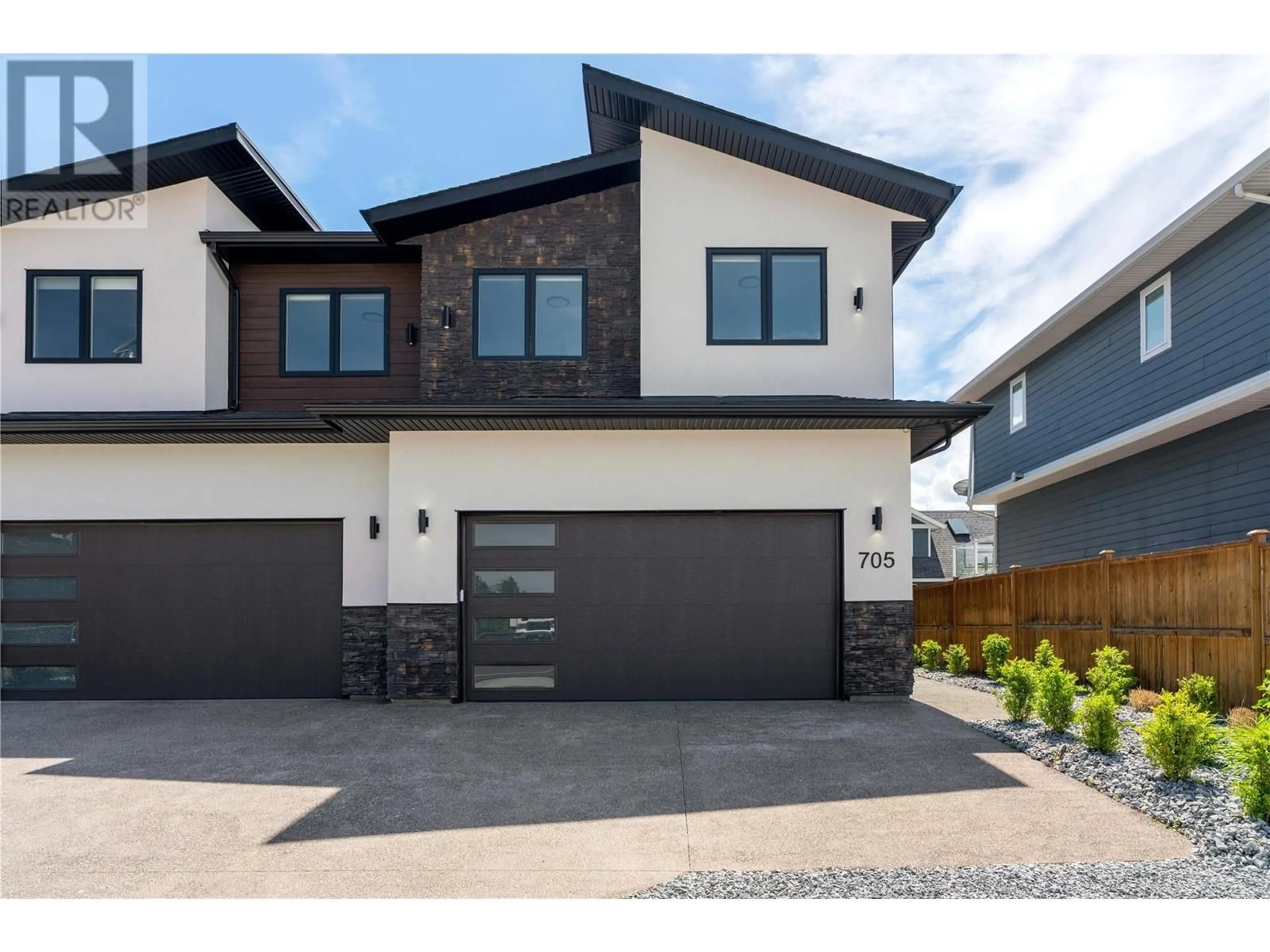 Home with vinyl exterior material, street for 705 RAYMER ROAD, Kelowna British Columbia V1W1H6