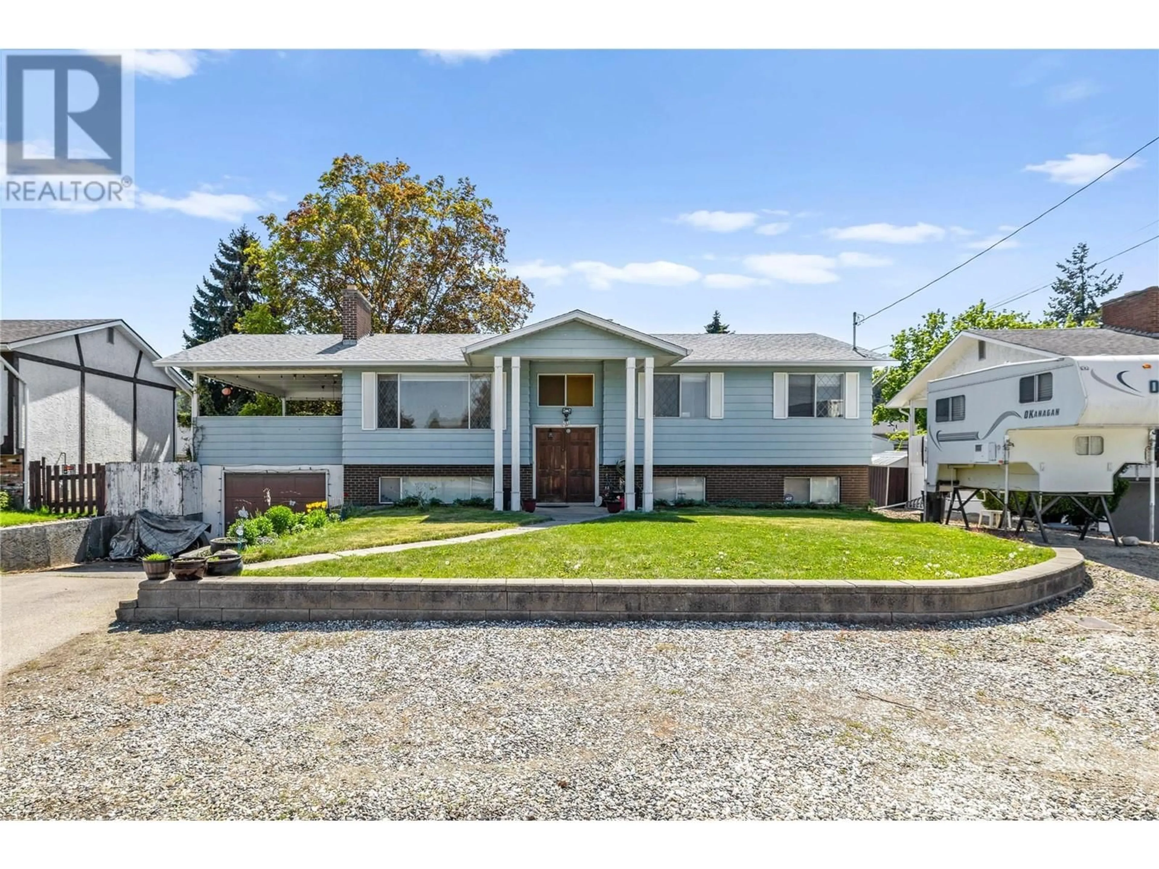 Home with vinyl exterior material, street for 765 WAYNE ROAD, Kelowna British Columbia V1X4L9
