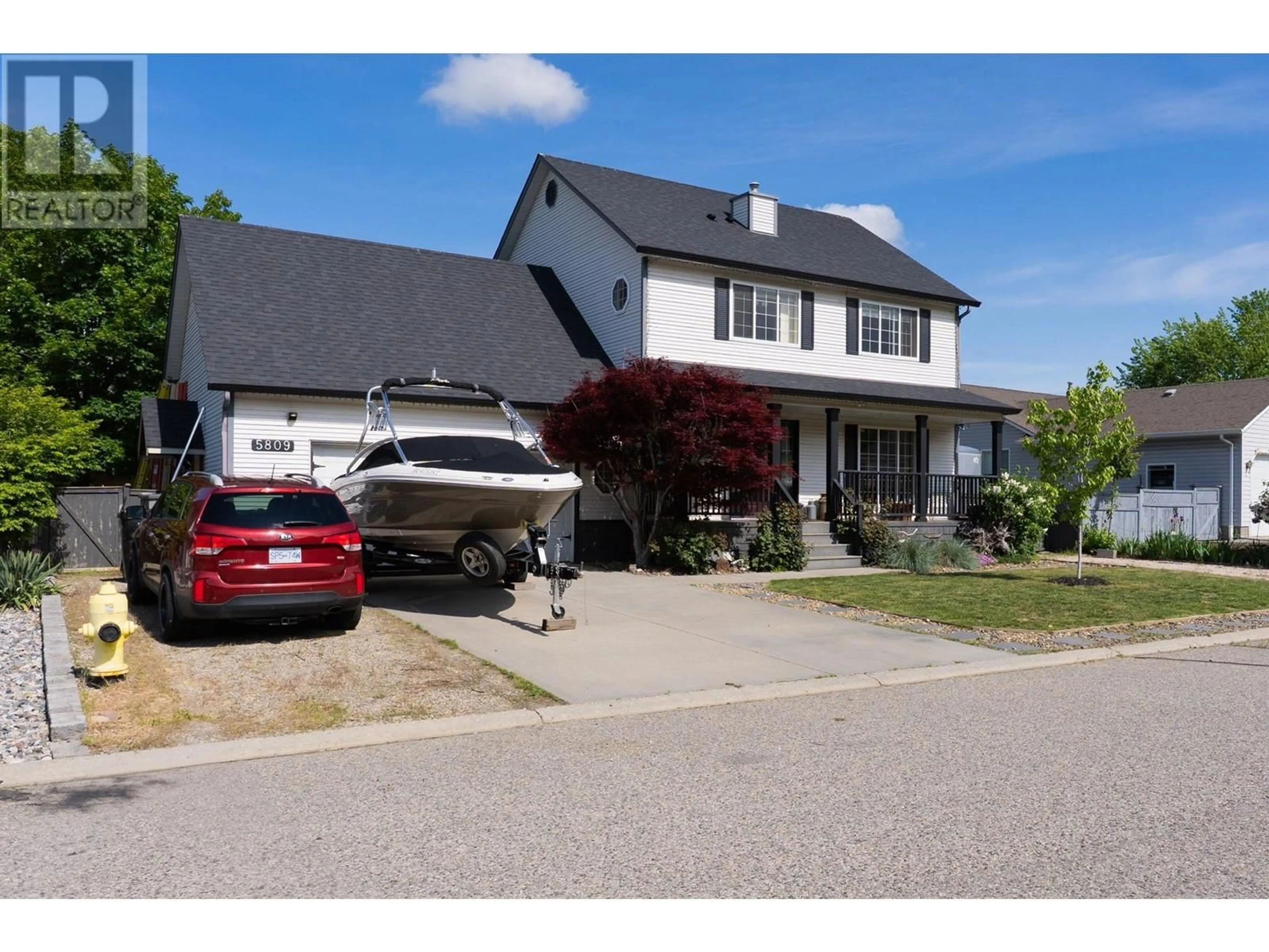Home with vinyl exterior material, street for 5809 CANARY DRIVE, Vernon British Columbia V1H1R3