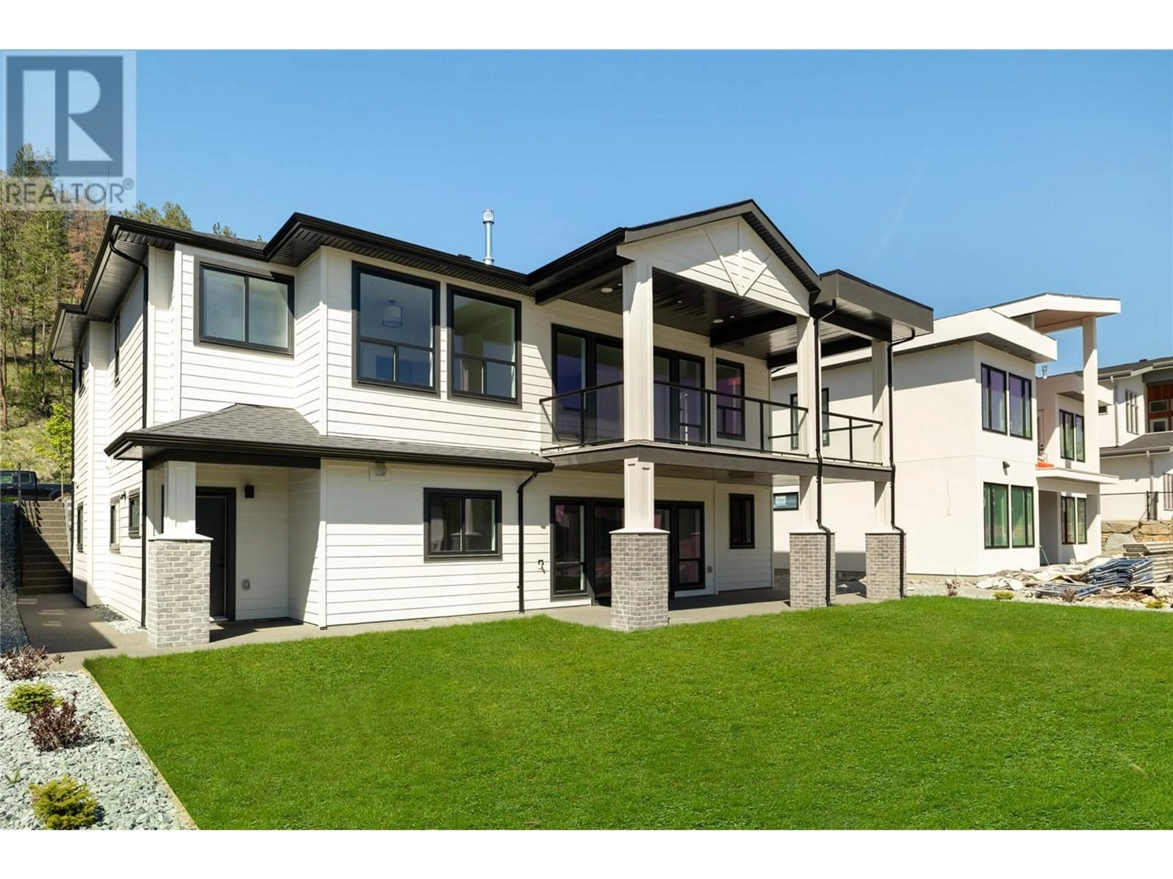 A pic from outside/outdoor area/front of a property/back of a property/a pic from drone, building for 893 LOSETH DRIVE, Kelowna British Columbia V1P0A8