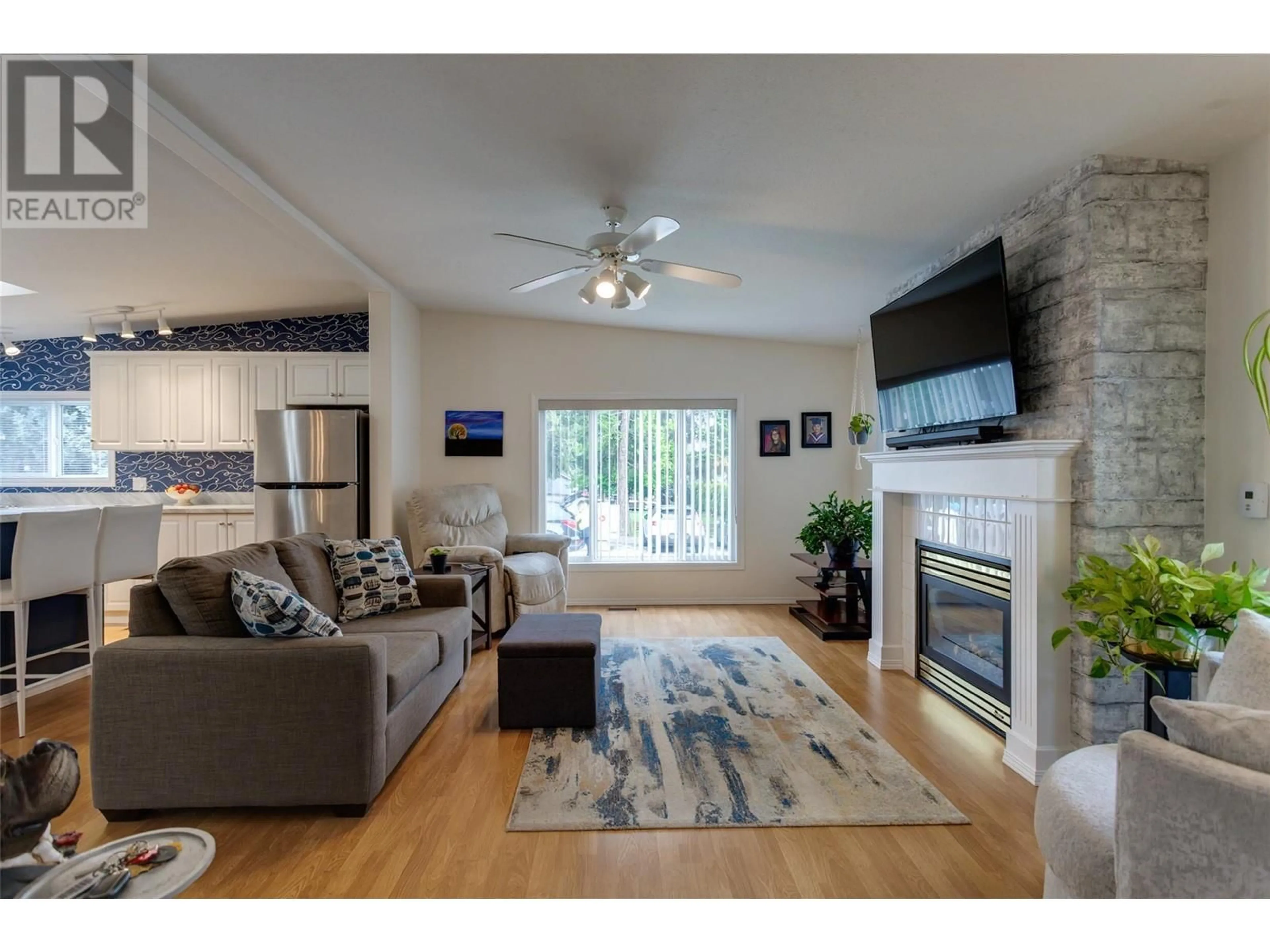 Living room with furniture, wood/laminate floor for 186 - 1850 SHANNON LAKE ROAD, West Kelowna British Columbia V4T1L4