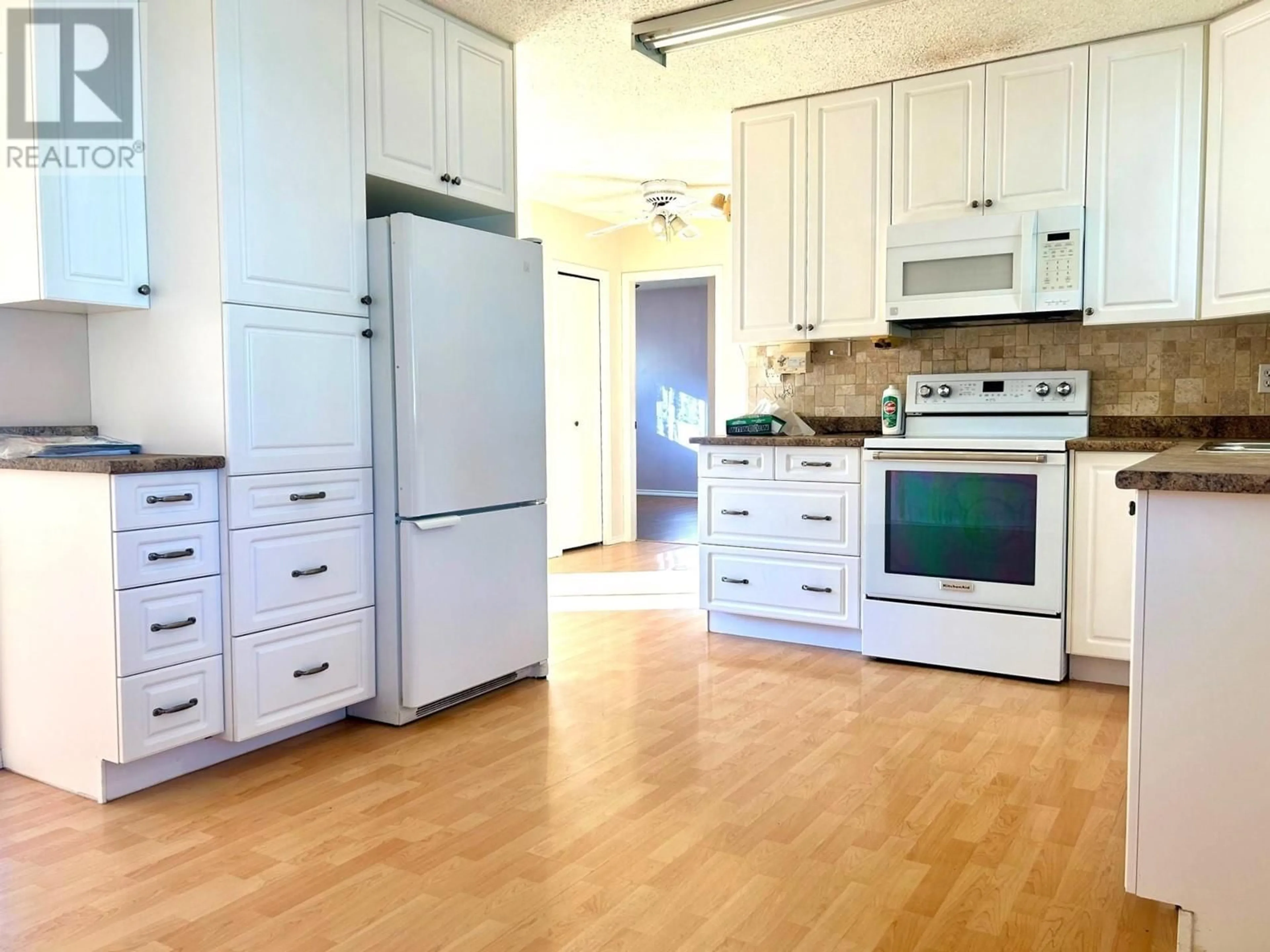 Open concept kitchen, wood/laminate floor for 403 ROBIN DRIVE, Barriere British Columbia V0E1E0
