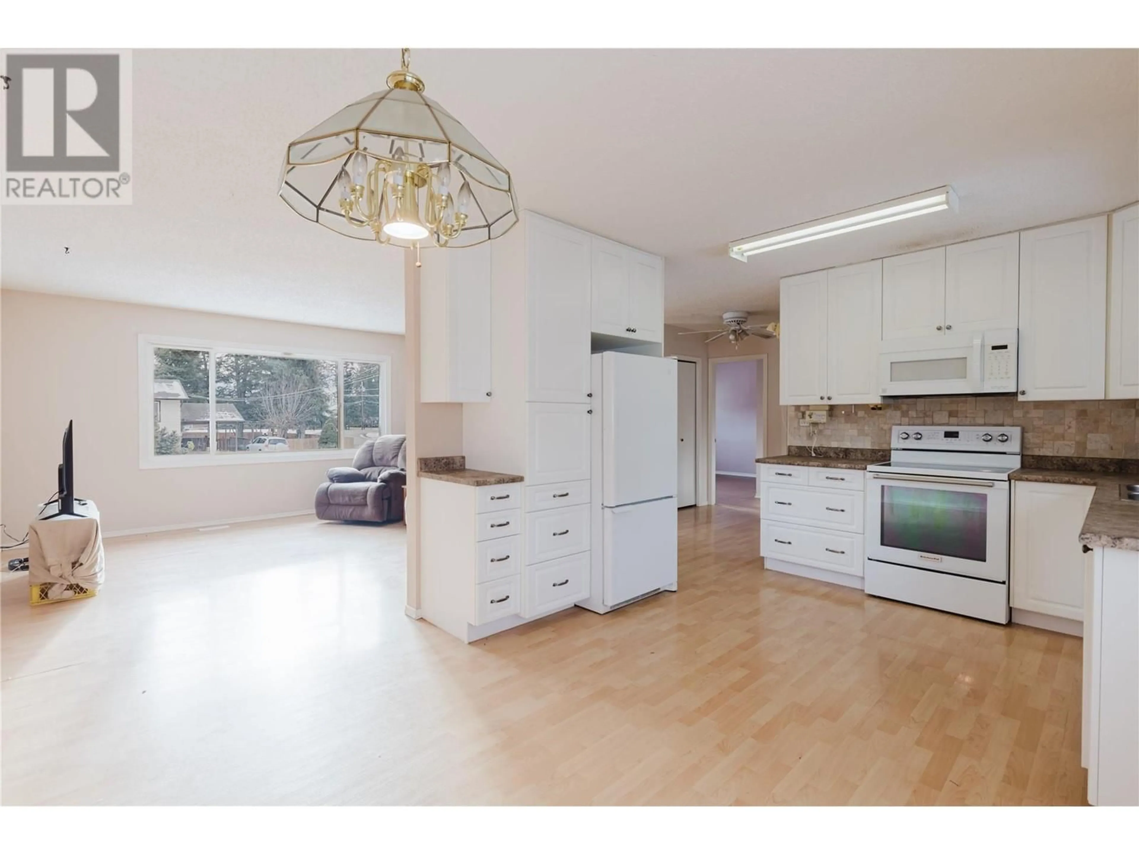 Open concept kitchen, wood/laminate floor for 403 ROBIN DRIVE, Barriere British Columbia V0E1E0