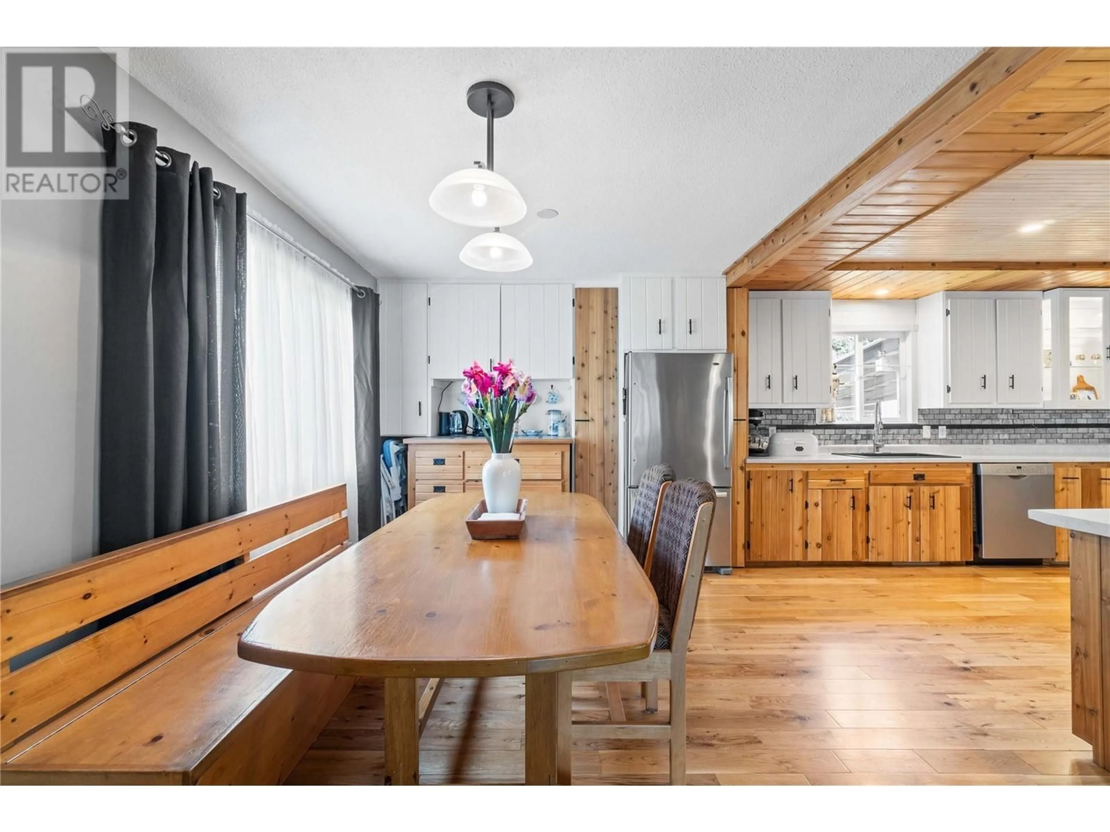 Open concept kitchen, wood/laminate floor for 1002 LARCH AVENUE, Sicamous British Columbia V0E2V0