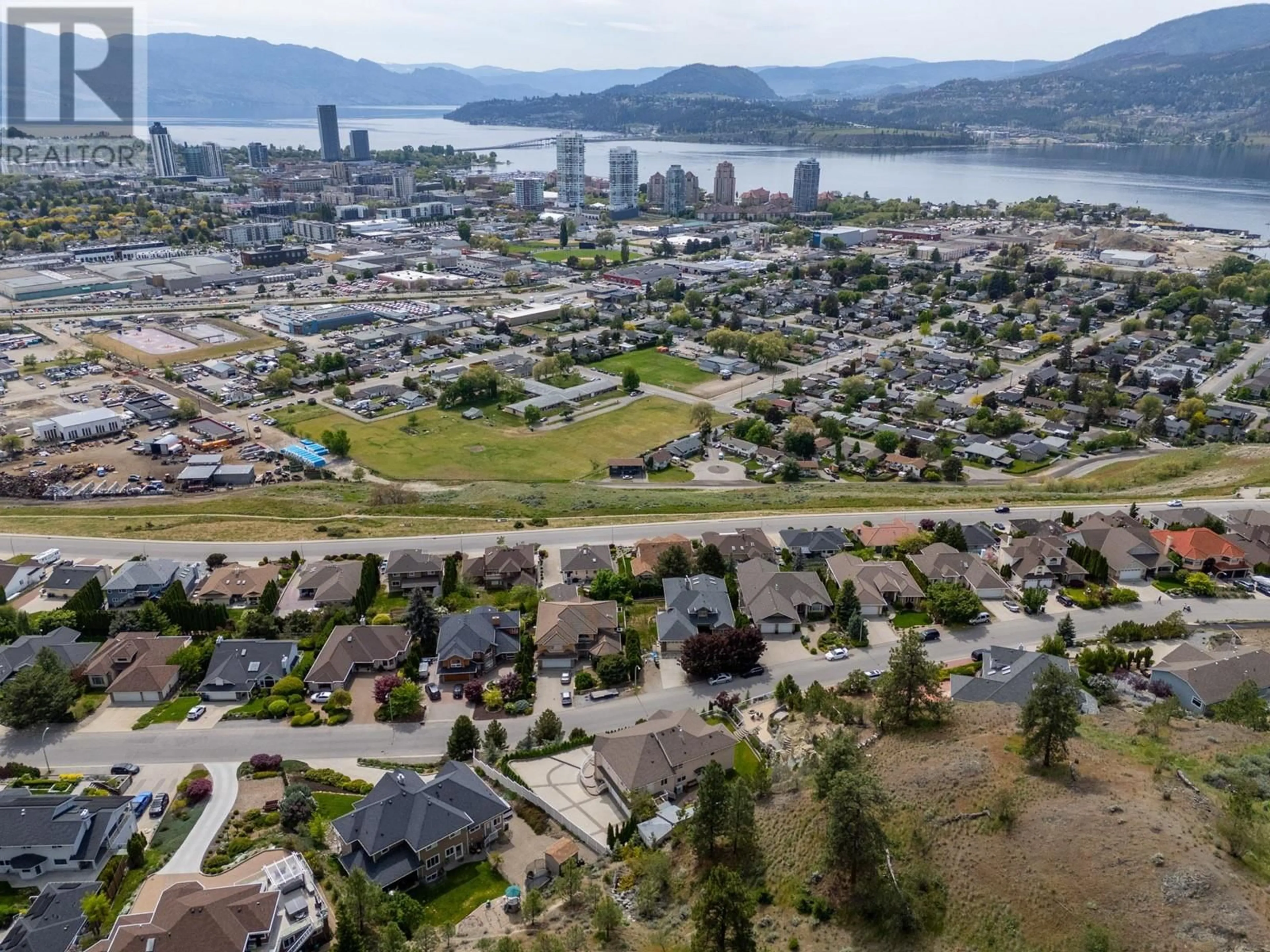 A pic from outside/outdoor area/front of a property/back of a property/a pic from drone, water/lake/river/ocean view for 705 ROYAL PINE DRIVE, Kelowna British Columbia V1Y9G2