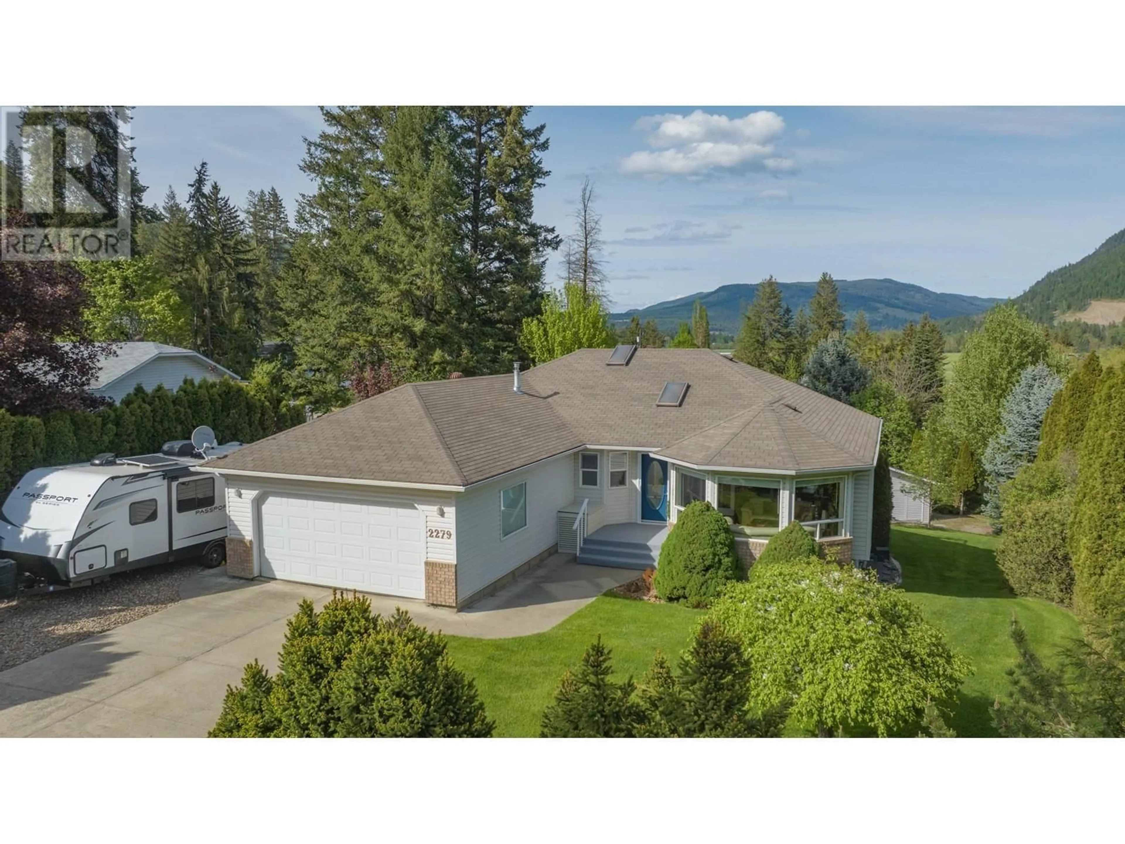 A pic from outside/outdoor area/front of a property/back of a property/a pic from drone, mountain view for 2279 CATT AVENUE, Lumby British Columbia V0E2G0