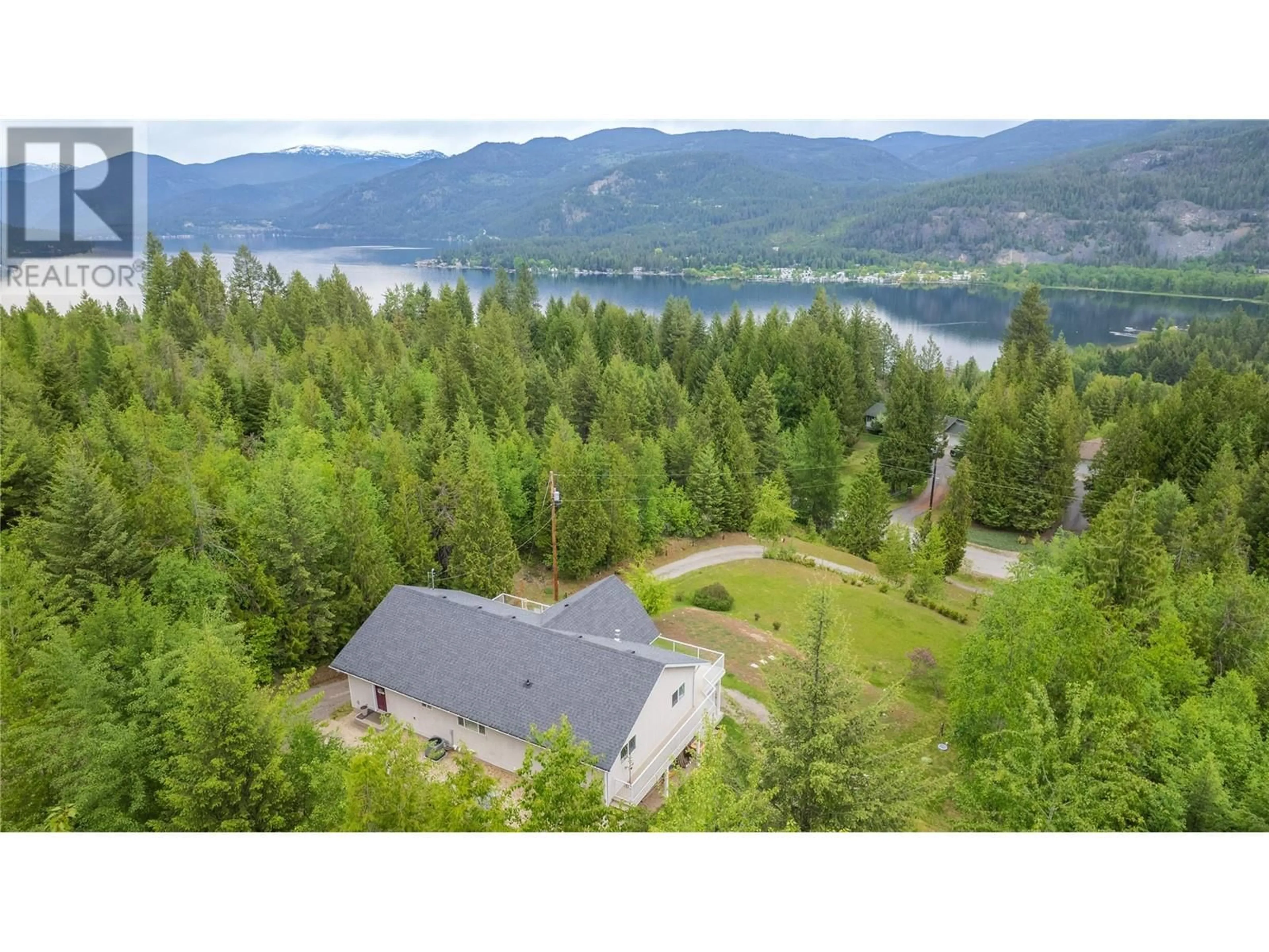 A pic from outside/outdoor area/front of a property/back of a property/a pic from drone, water/lake/river/ocean view for 242 CHASE ROAD, Christina Lake British Columbia V0H1E0