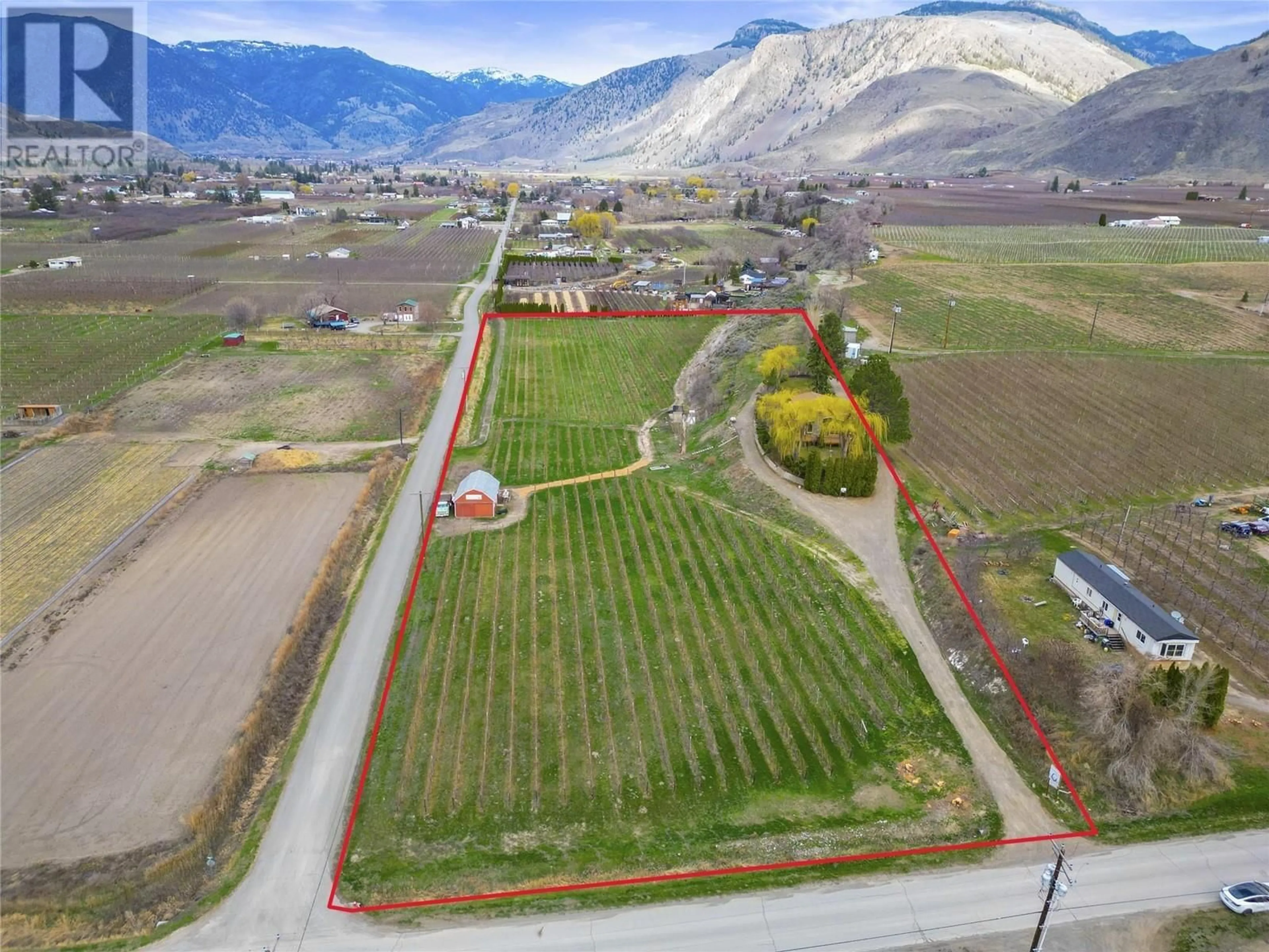 A pic from outside/outdoor area/front of a property/back of a property/a pic from drone, mountain view for 715 LOWE DRIVE, Cawston British Columbia V0X1C2