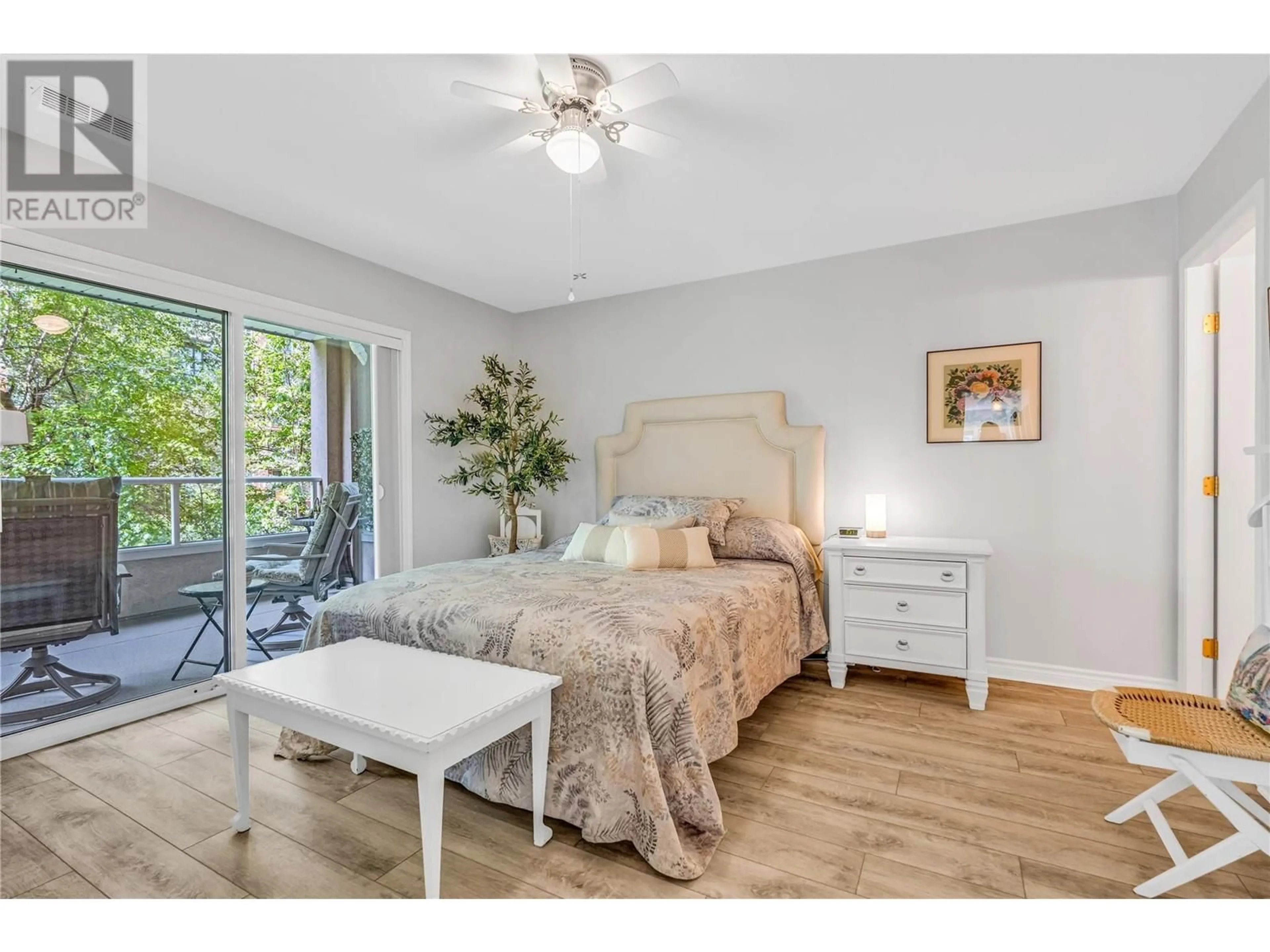 Bedroom with bed, wood/laminate floor for 201 - 2245 ATKINSON STREET, Penticton British Columbia V2A8R7