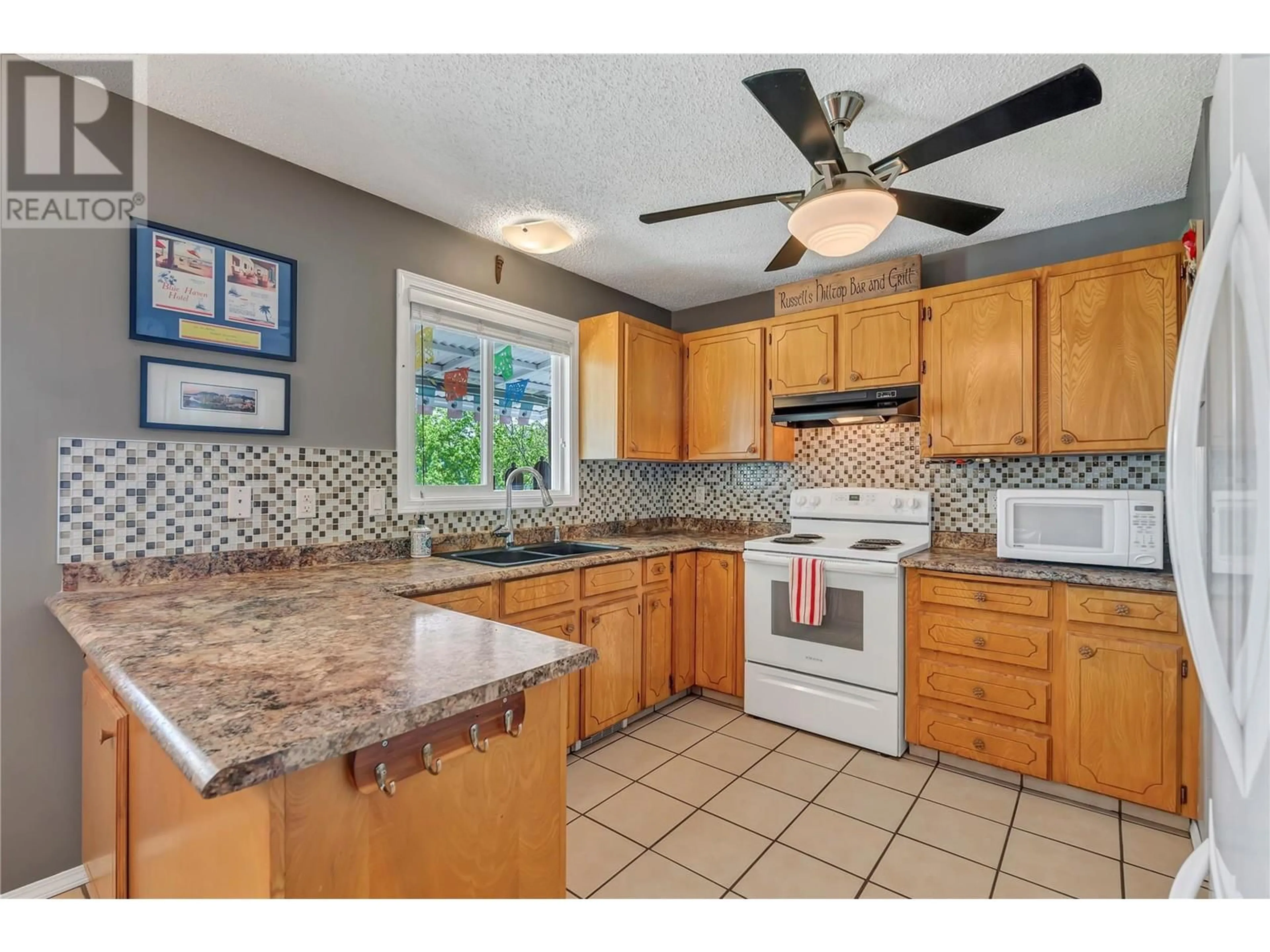 Open concept kitchen, ceramic/tile floor for 14205 CARTWRIGHT AVENUE, Summerland British Columbia V0H1Z8