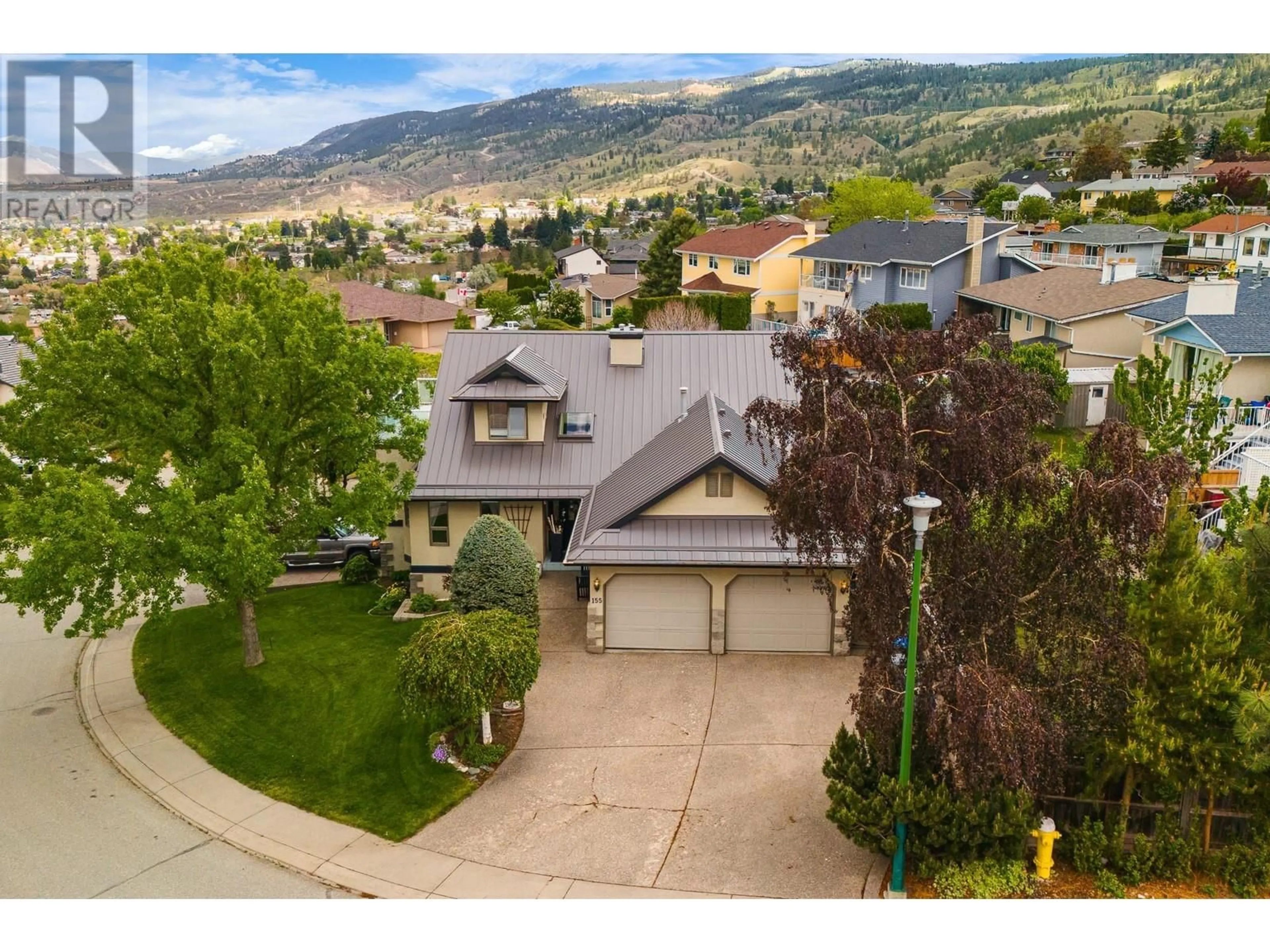 A pic from outside/outdoor area/front of a property/back of a property/a pic from drone, mountain view for 155 ANVIL CRESCENT, Kamloops British Columbia V2C6E2