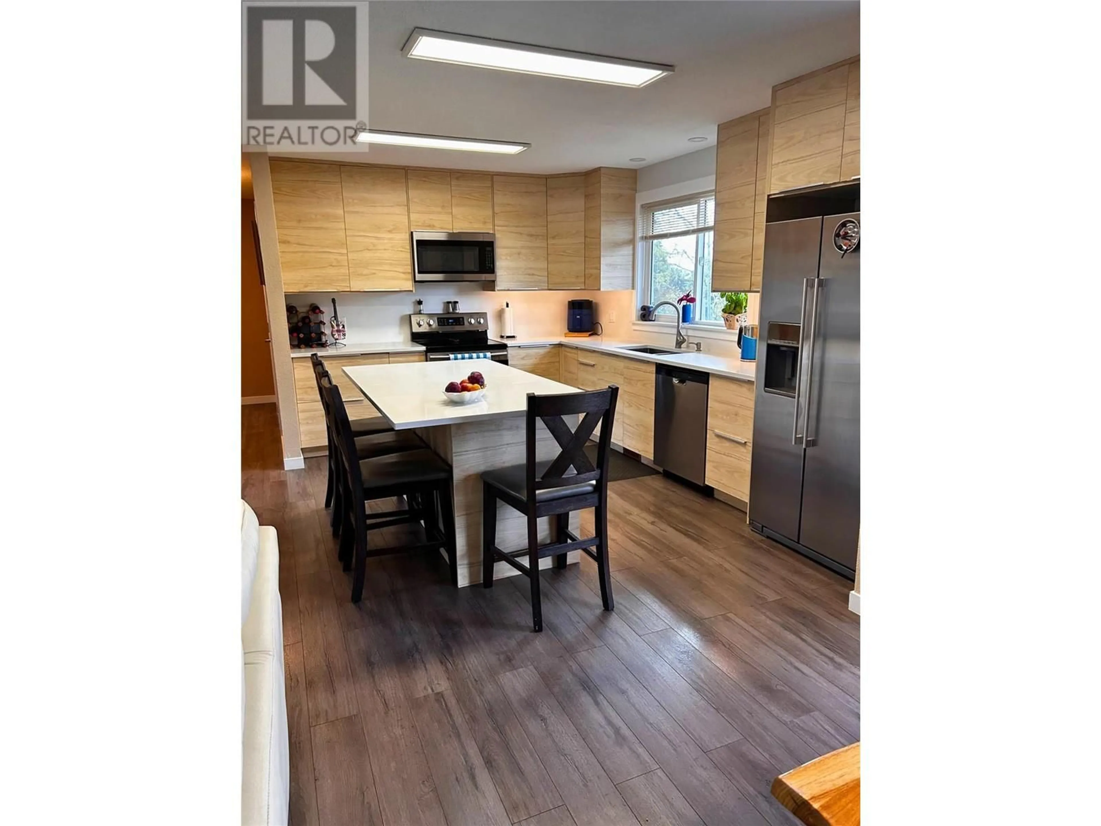 Open concept kitchen, wood/laminate floor for 41 BRECCIA DRIVE, Logan Lake British Columbia V0K1W0