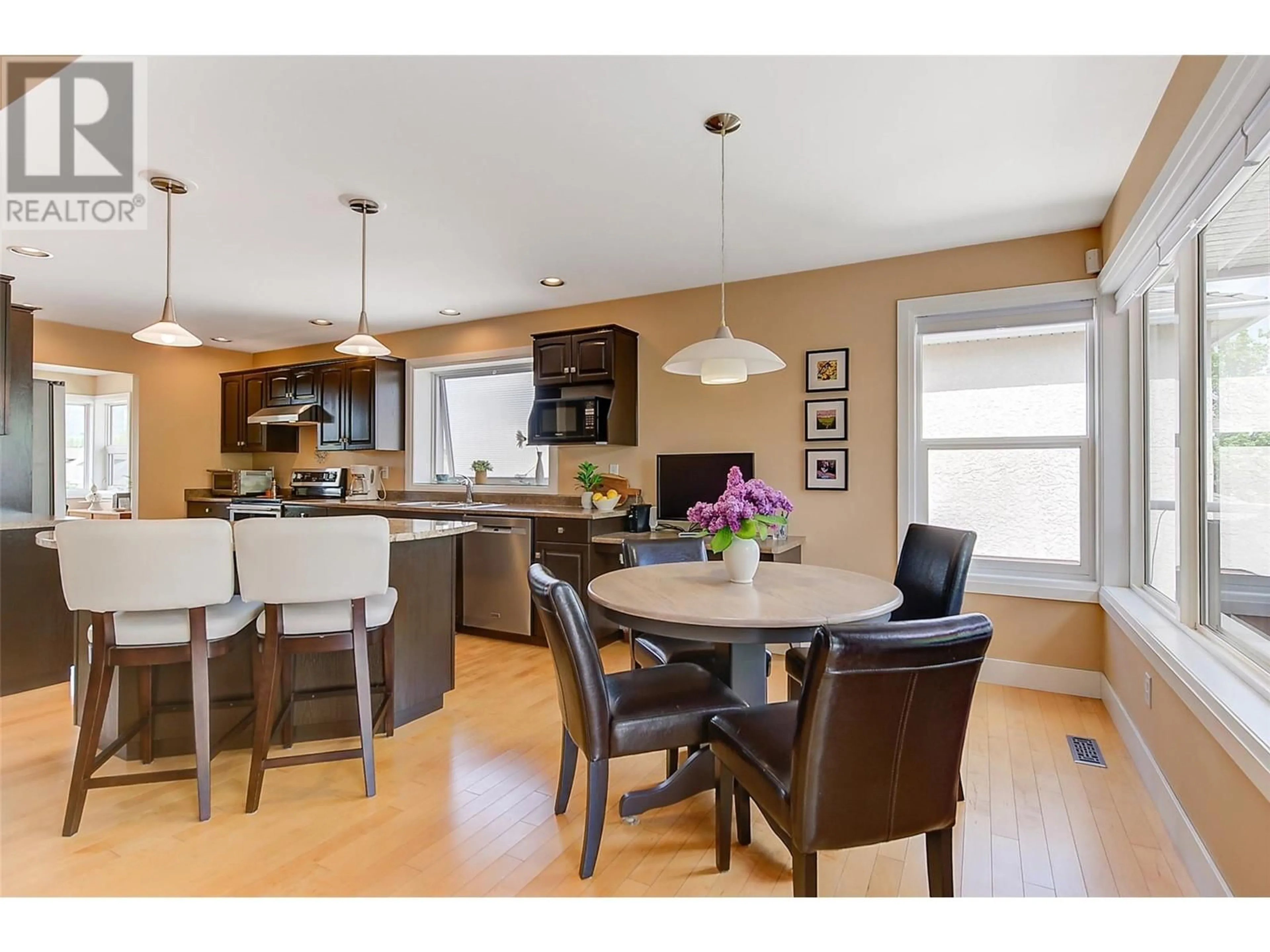 Open concept kitchen, wood/laminate floor for 3721 MISSION SPRINGS DRIVE, Kelowna British Columbia V1W3L8