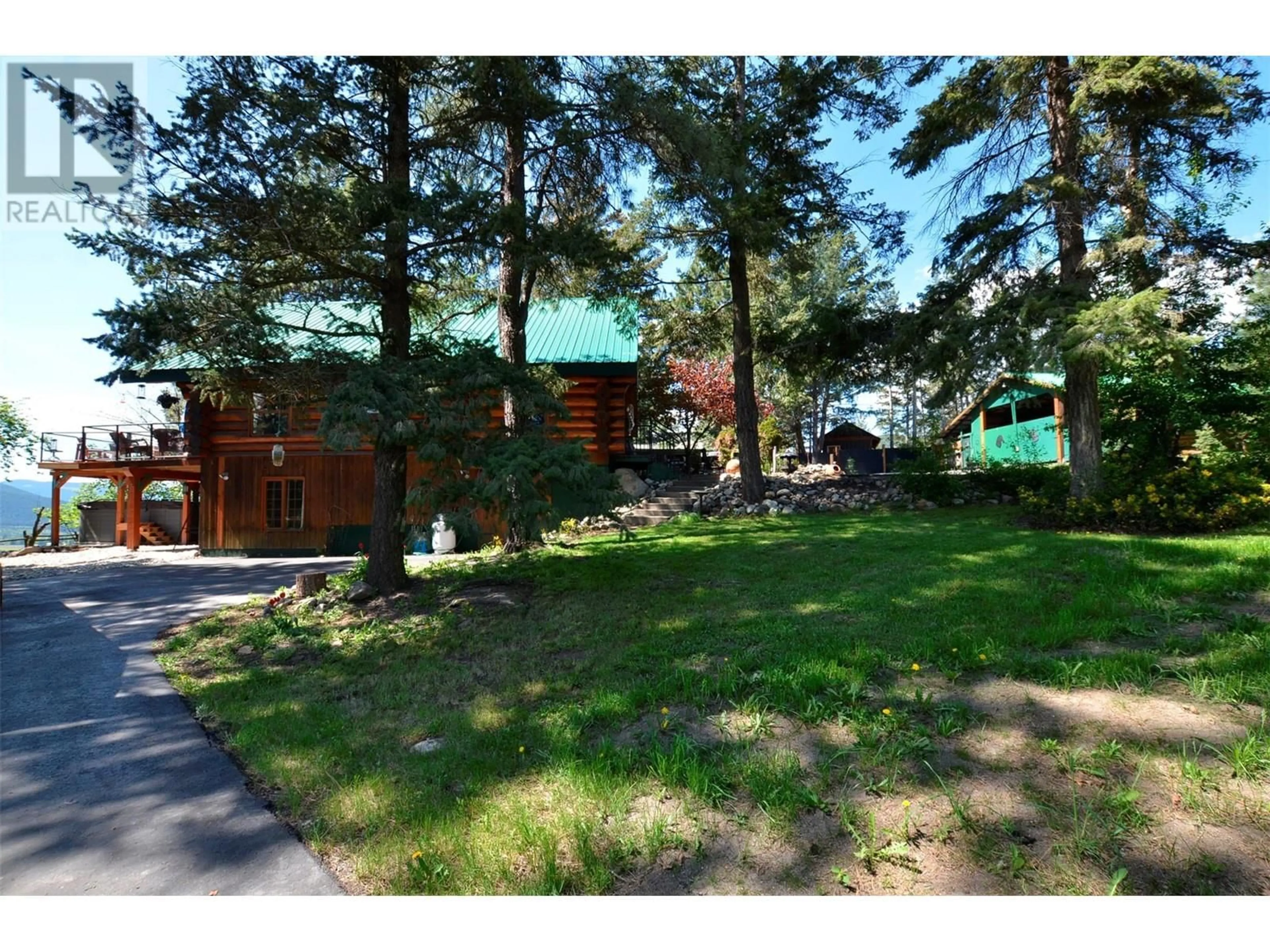 A pic from outside/outdoor area/front of a property/back of a property/a pic from drone, forest/trees view for 60 VALEVIEW ROAD, Lumby British Columbia V0E2G1