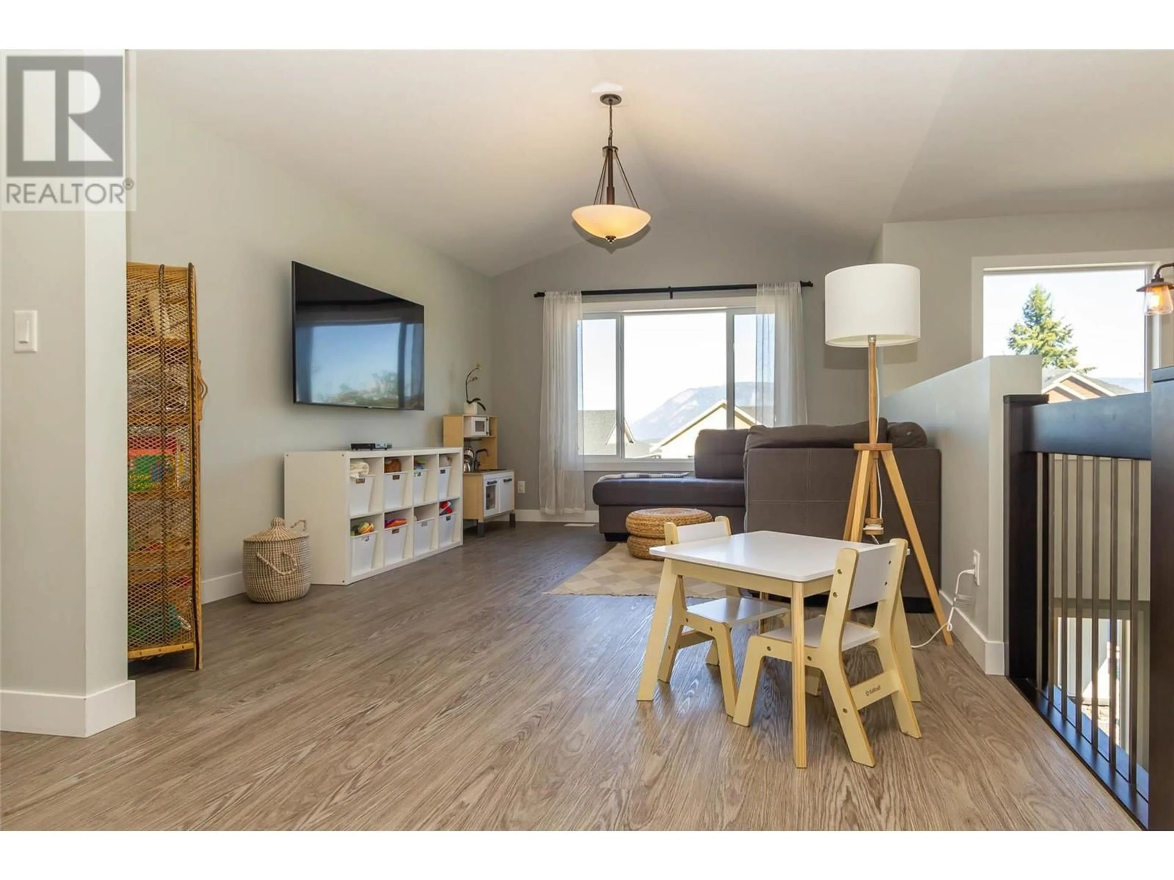 Living room with furniture, wood/laminate floor for 2368 4B AVENUE SOUTHEAST, Salmon Arm British Columbia V1E1K9