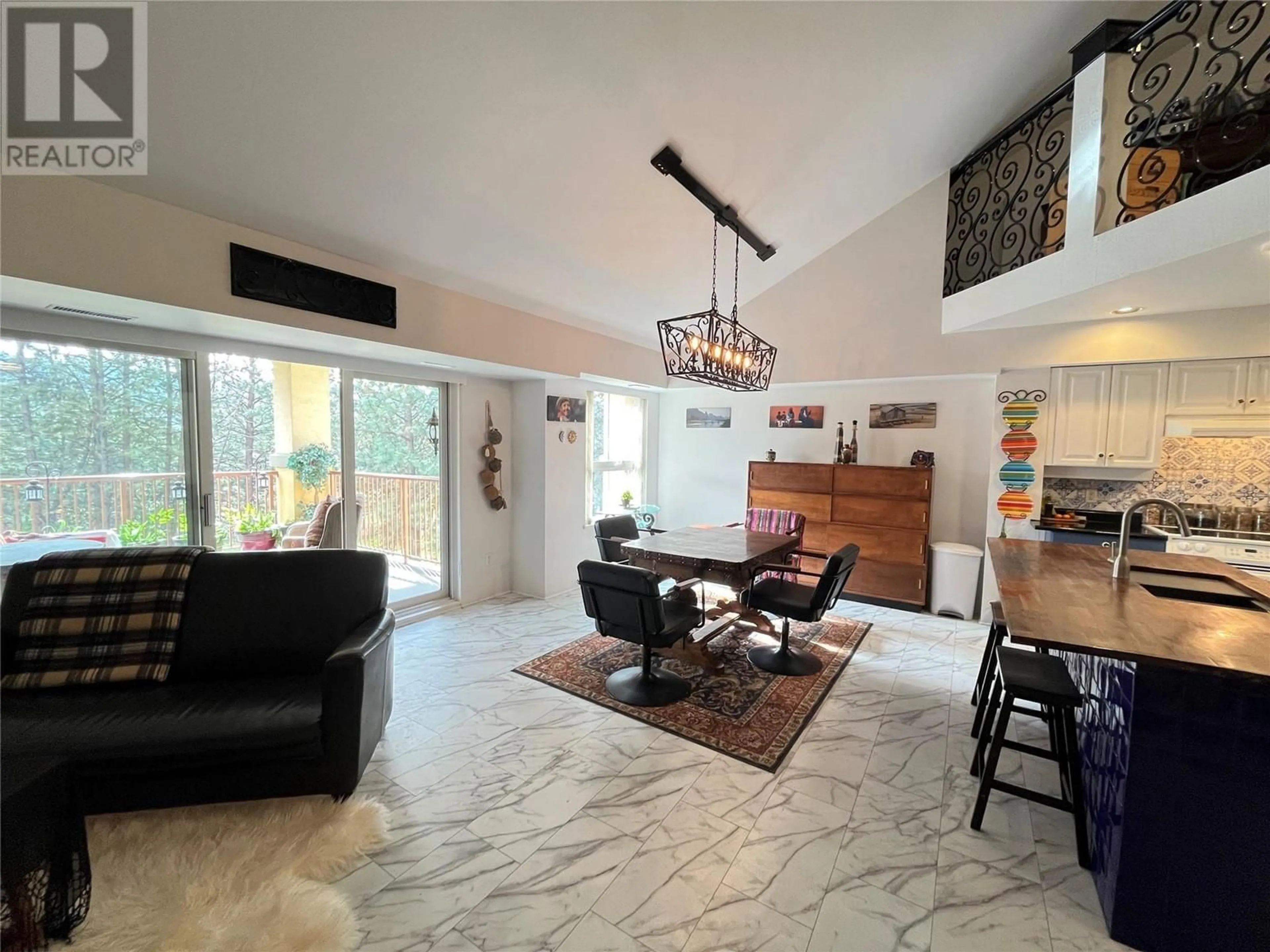 Living room with furniture, ceramic/tile floor for 203 - 3179 VIA CENTRALE ROAD, Kelowna British Columbia V1V2J5