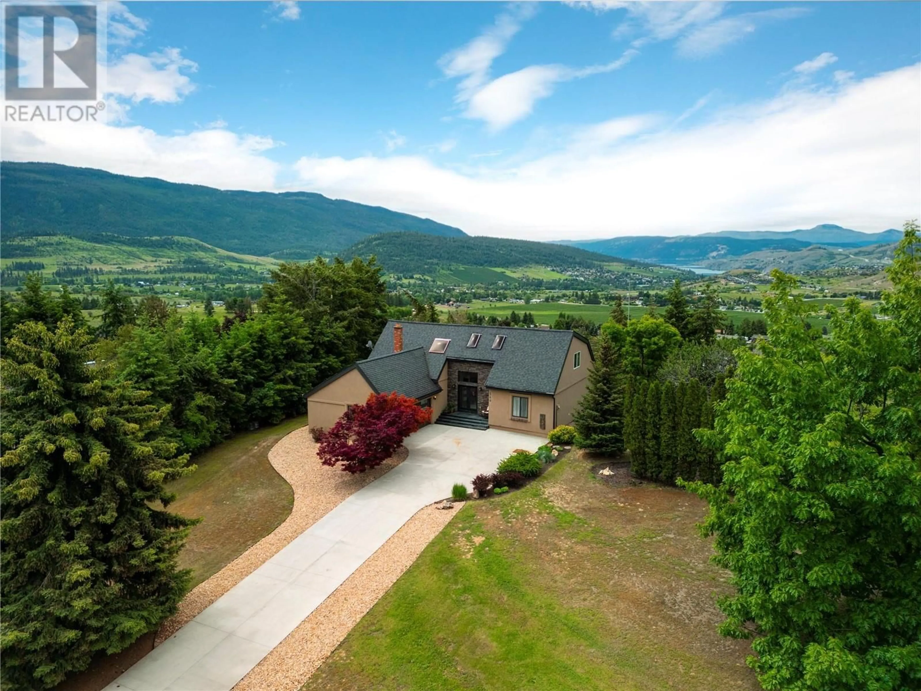 A pic from outside/outdoor area/front of a property/back of a property/a pic from drone, mountain view for 548 UPLAND DRIVE, Coldstream British Columbia V1B2X8