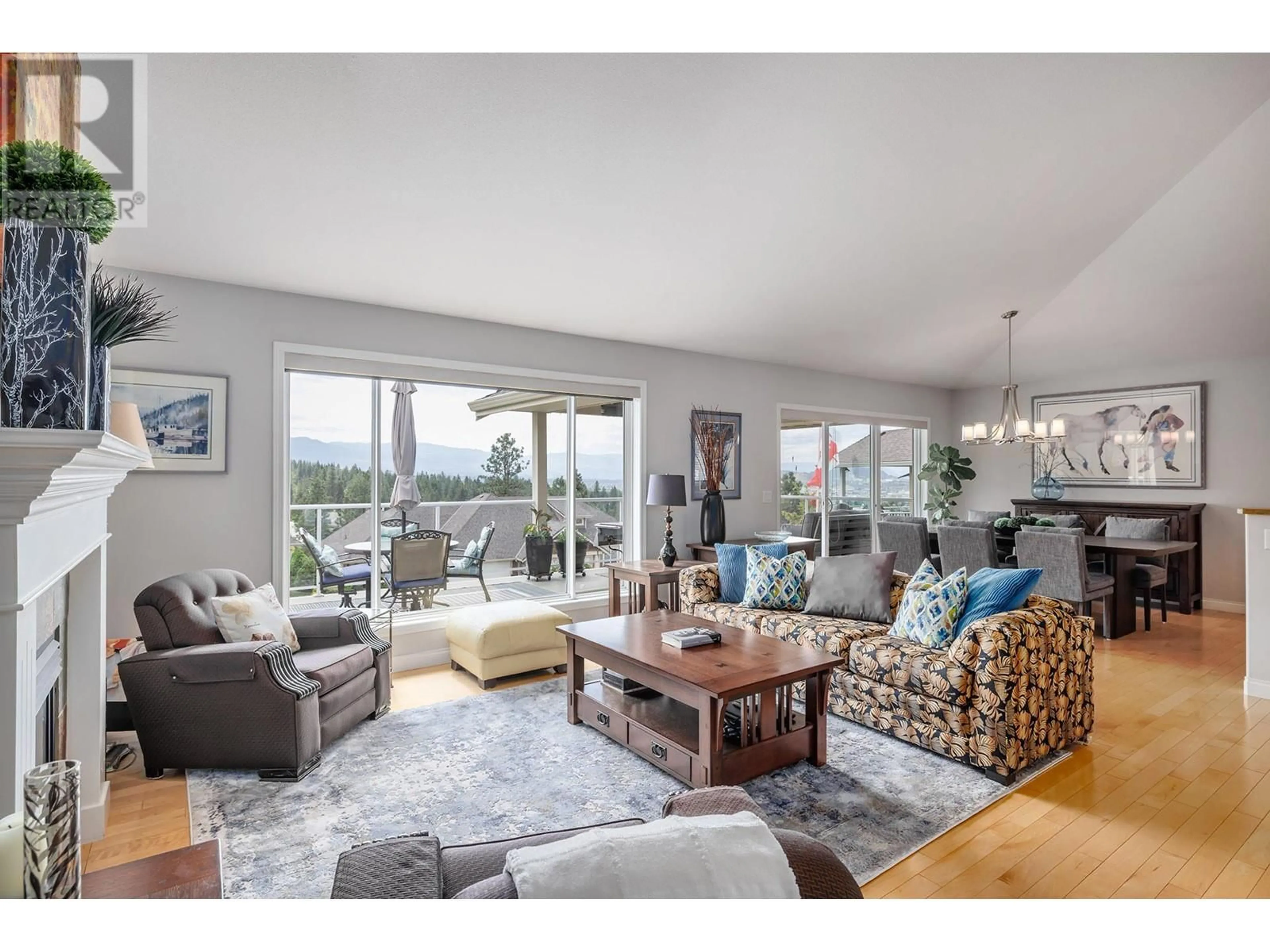 Living room with furniture, wood/laminate floor for 3936 SUNSET RANCH DRIVE, Kelowna British Columbia V1X7X8