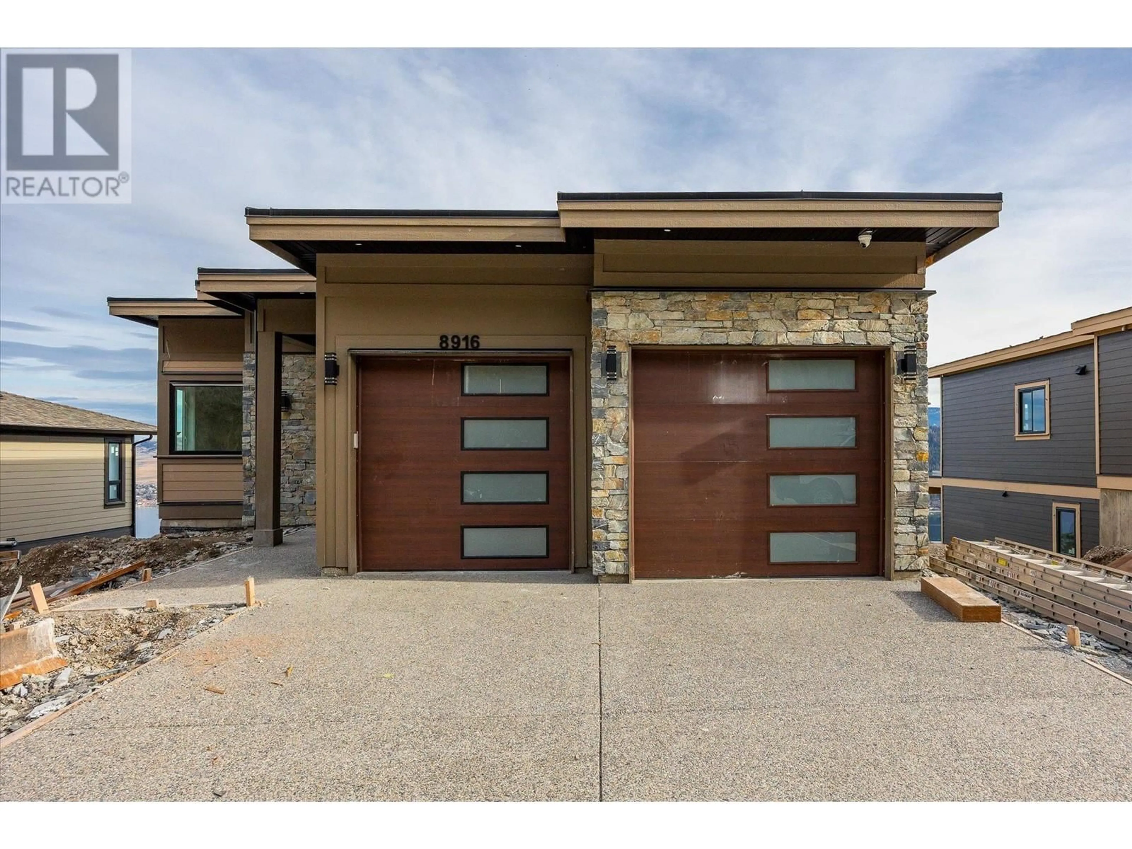 Home with brick exterior material, street for 8916 TAVISTOCK ROAD, Vernon British Columbia V1H2L4