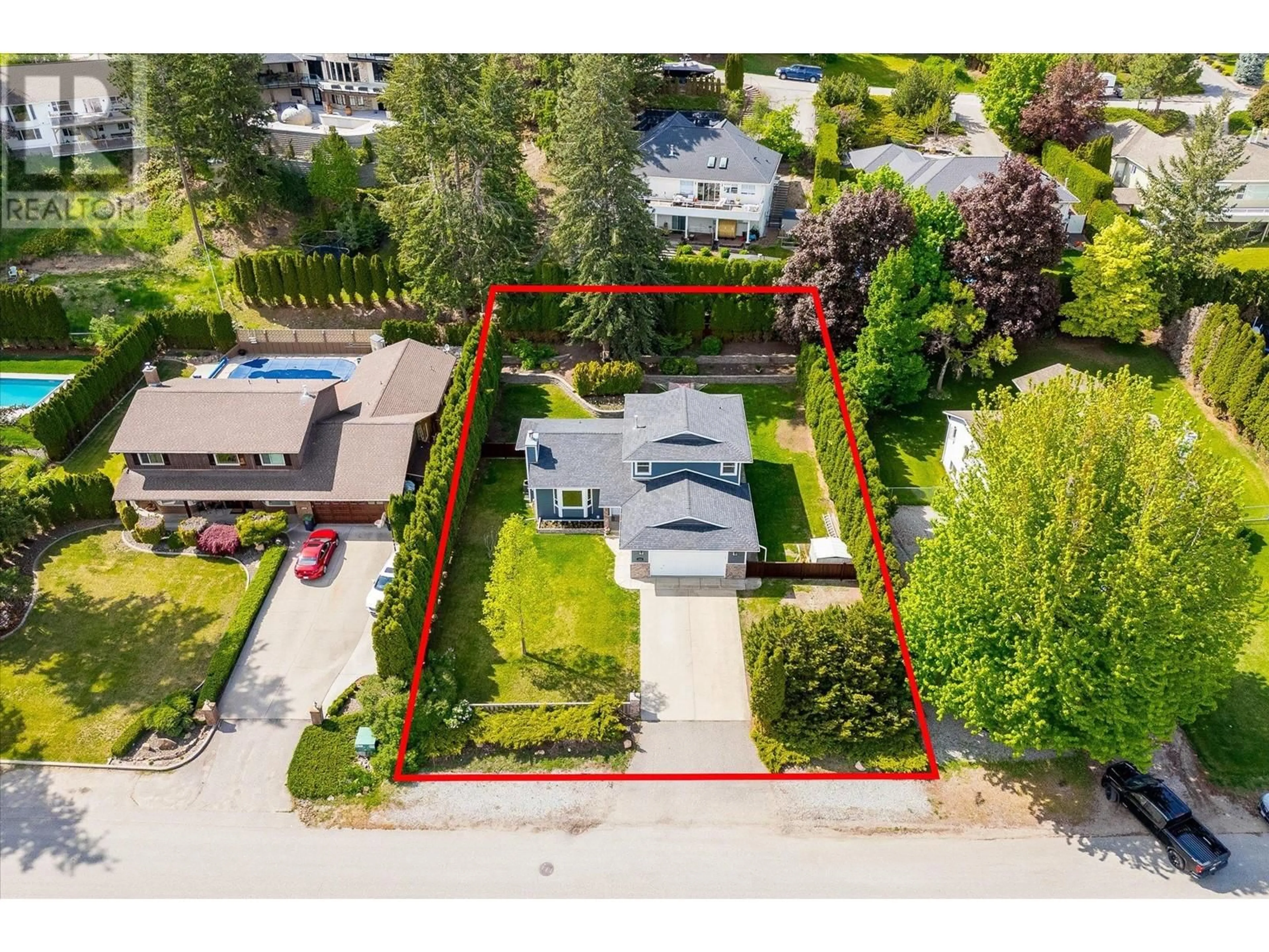 A pic from outside/outdoor area/front of a property/back of a property/a pic from drone, street for 1586 BLACKWOOD DRIVE, West Kelowna British Columbia V1Z3B7