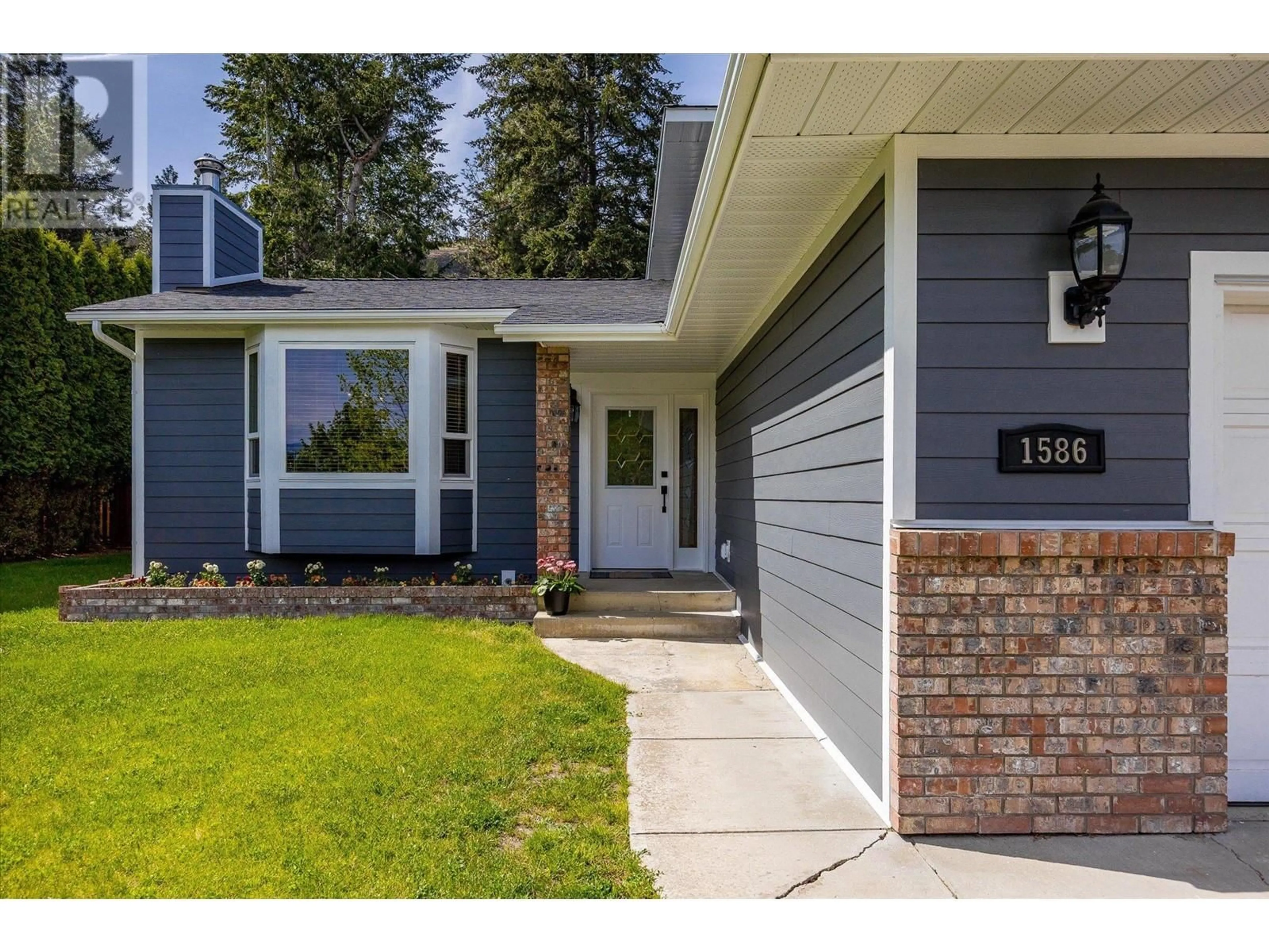 Home with vinyl exterior material, street for 1586 BLACKWOOD DRIVE, West Kelowna British Columbia V1Z3B7