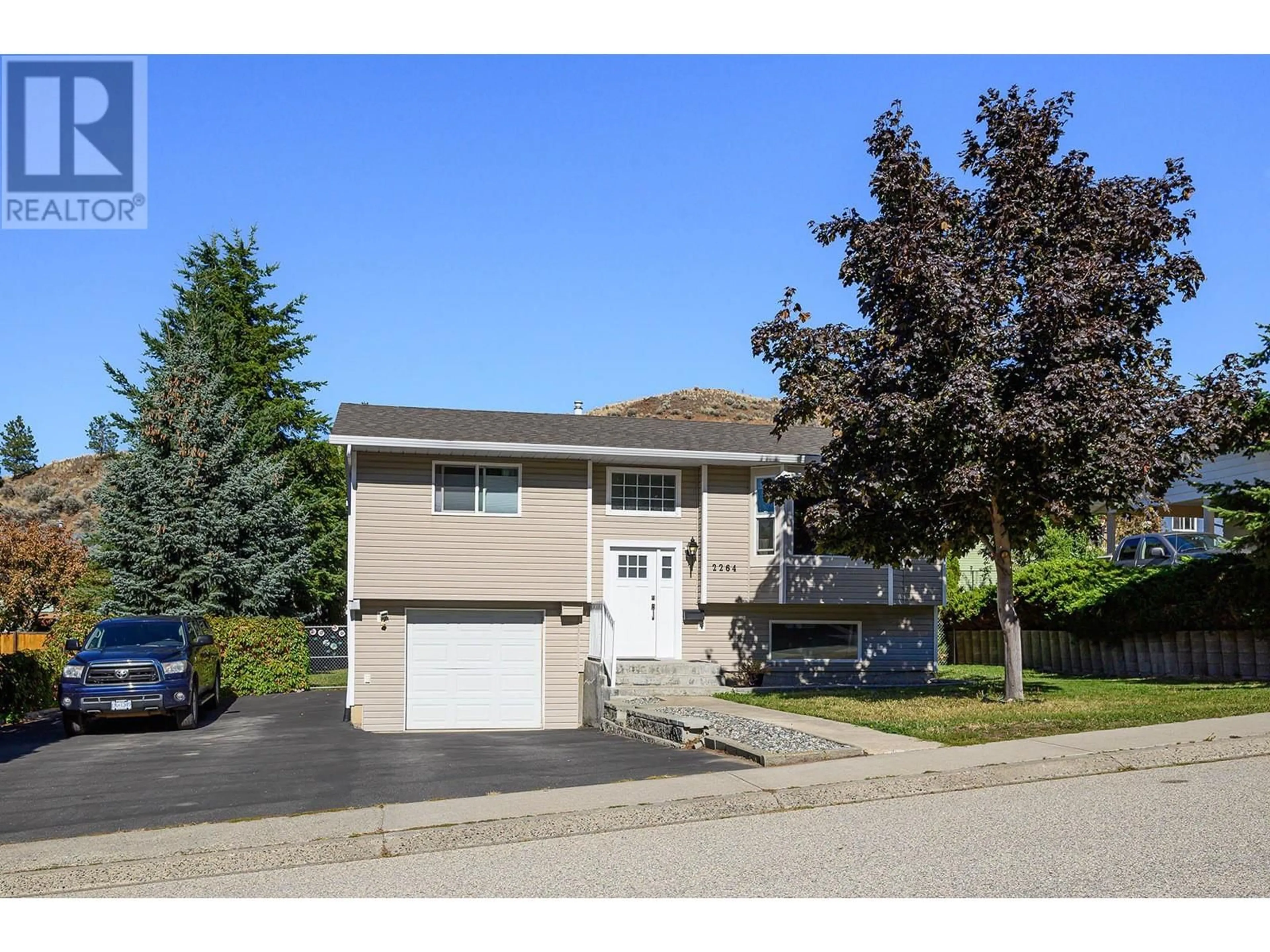 Home with vinyl exterior material, street for 2264 NECHAKO DRIVE, Kamloops British Columbia V2E1S5