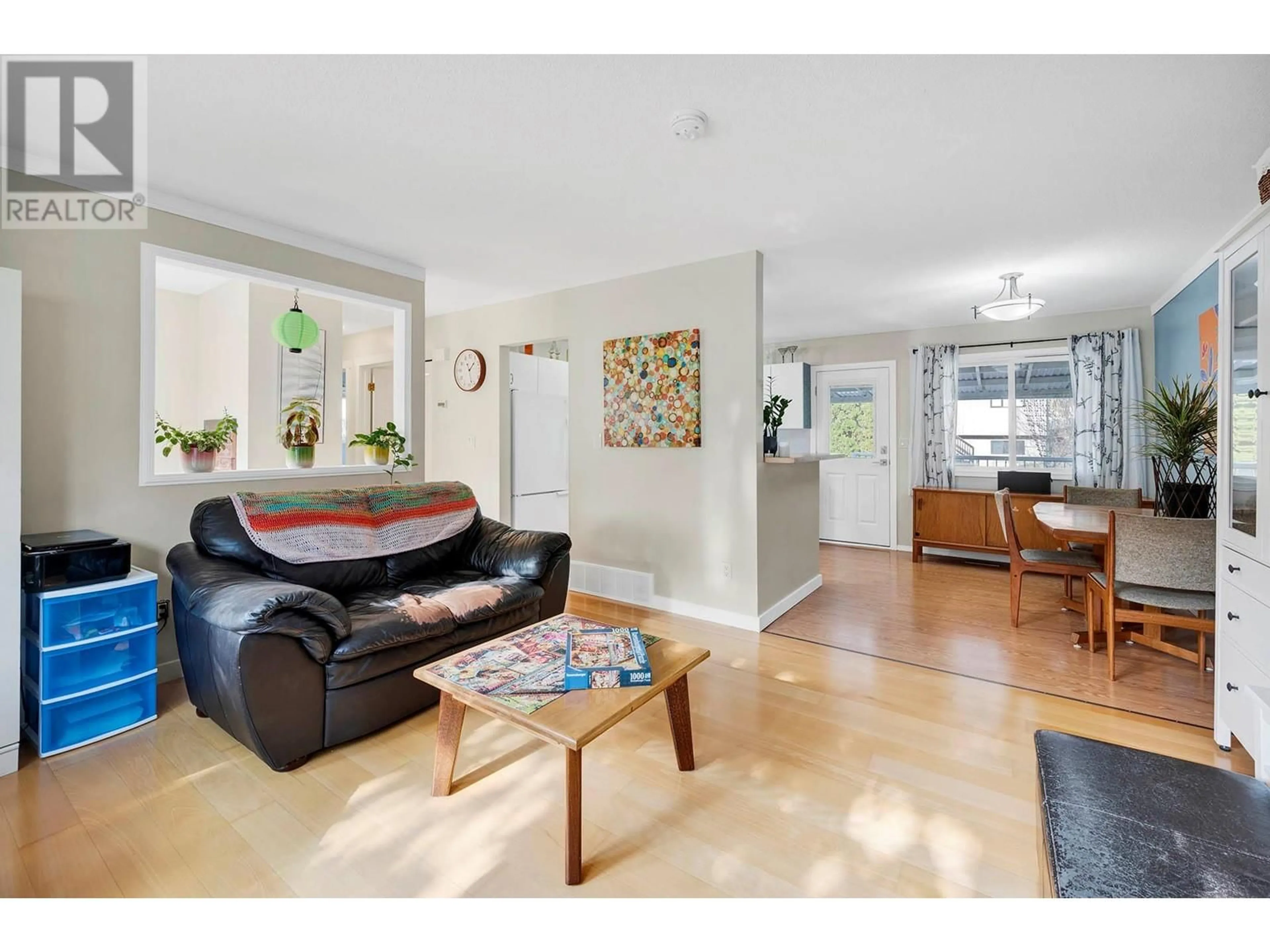 Living room with furniture, wood/laminate floor for 2264 NECHAKO DRIVE, Kamloops British Columbia V2E1S5