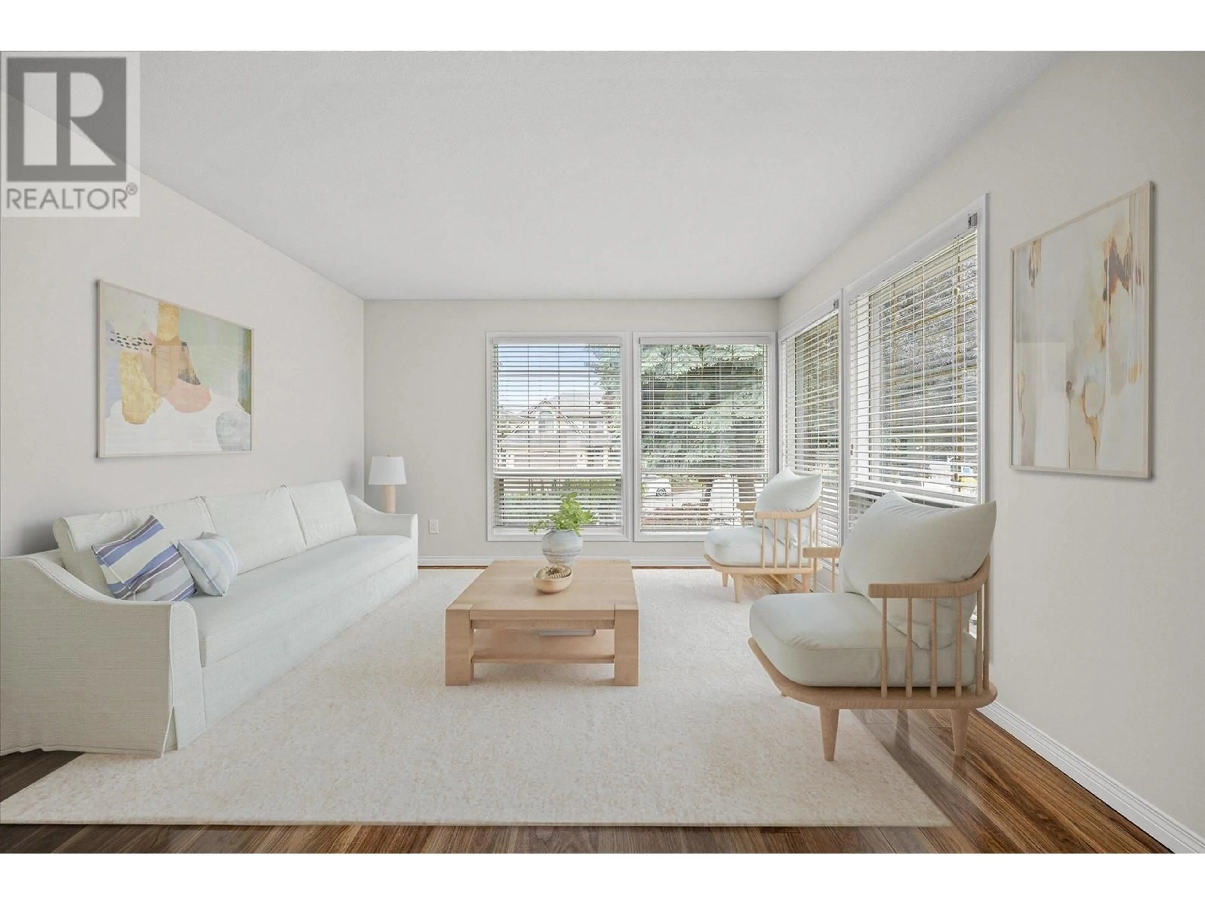 Living room with furniture, wood/laminate floor for 1856 PORTLAND PLACE, Kelowna British Columbia V1V1P9