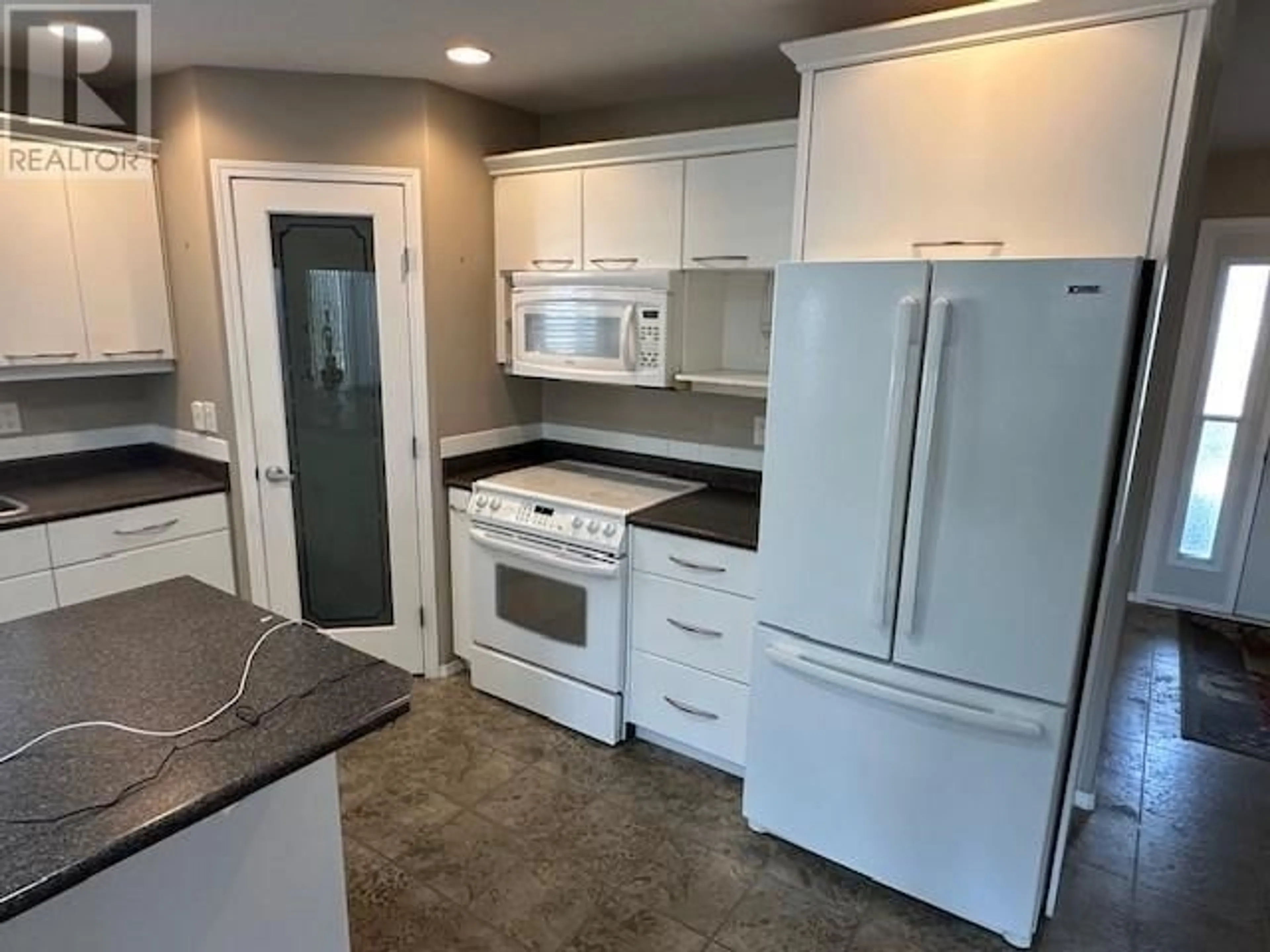 Standard kitchen, ceramic/tile floor for 568 RED WING DRIVE, Penticton British Columbia V2A8N7