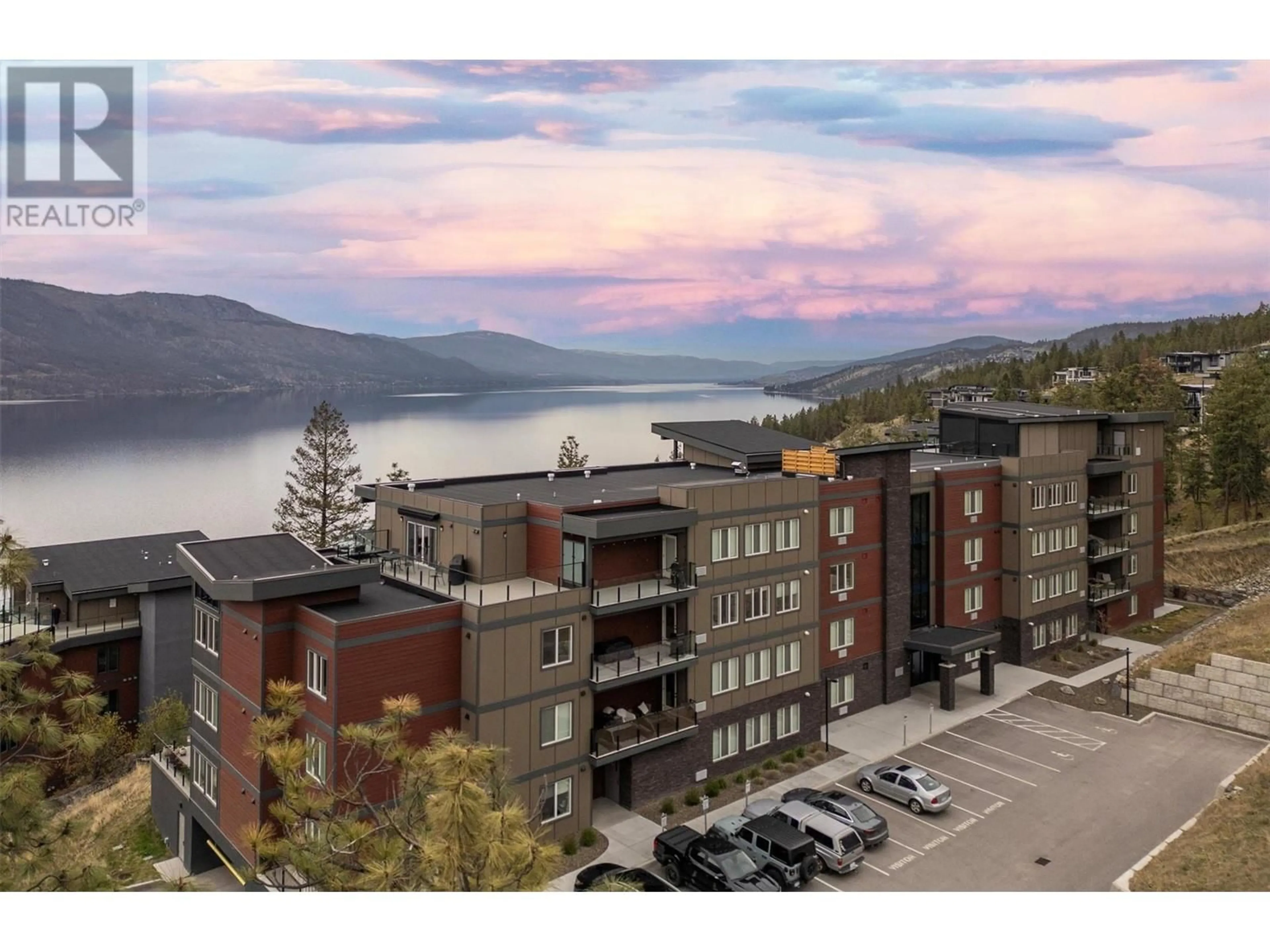 A pic from outside/outdoor area/front of a property/back of a property/a pic from drone, water/lake/river/ocean view for 301 - 3434 MCKINLEY BEACH DRIVE, Kelowna British Columbia V1V0H3
