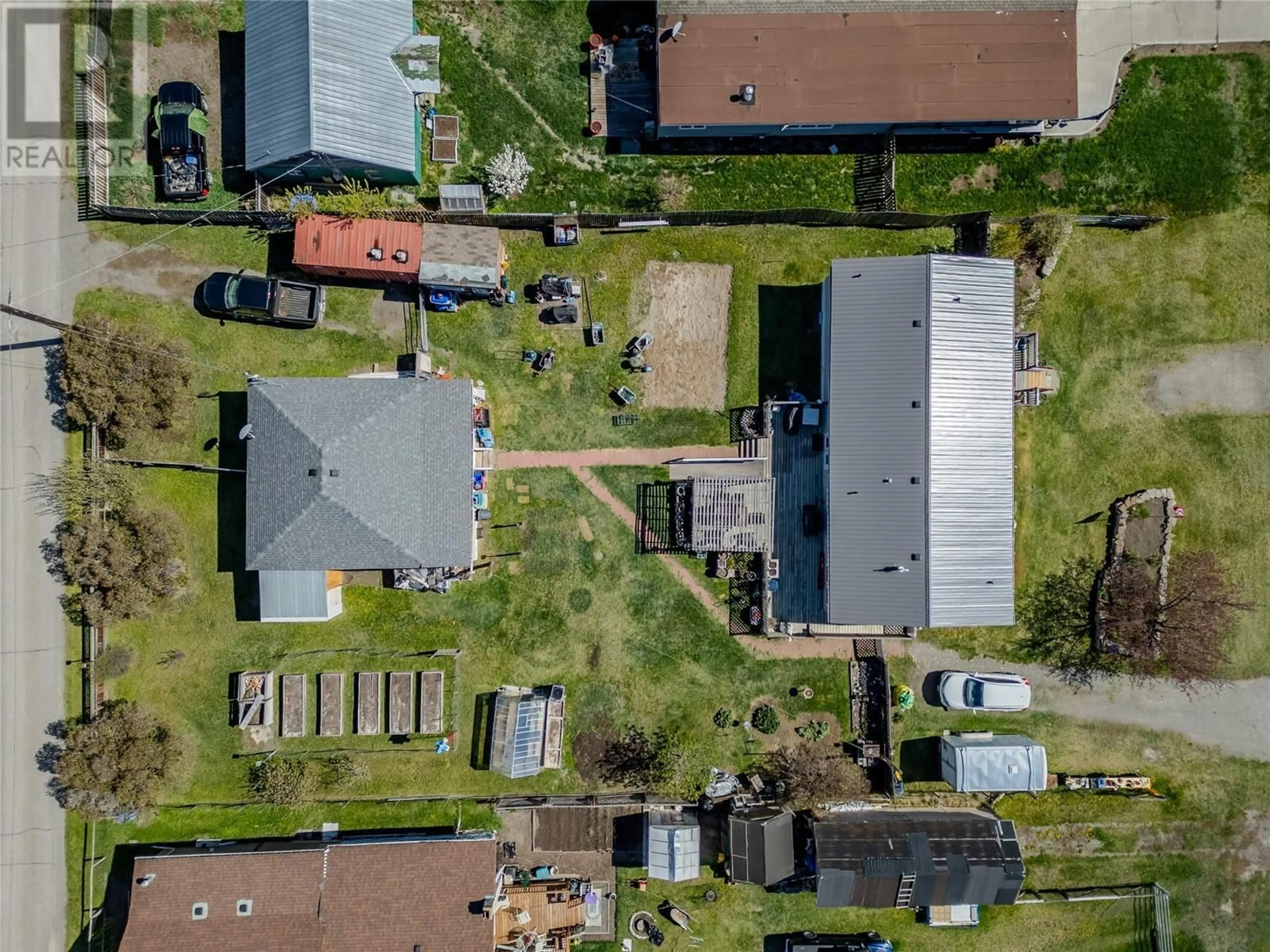 A pic from outside/outdoor area/front of a property/back of a property/a pic from drone, street for 1418 SOUES STREET, Clinton British Columbia V0K1K0