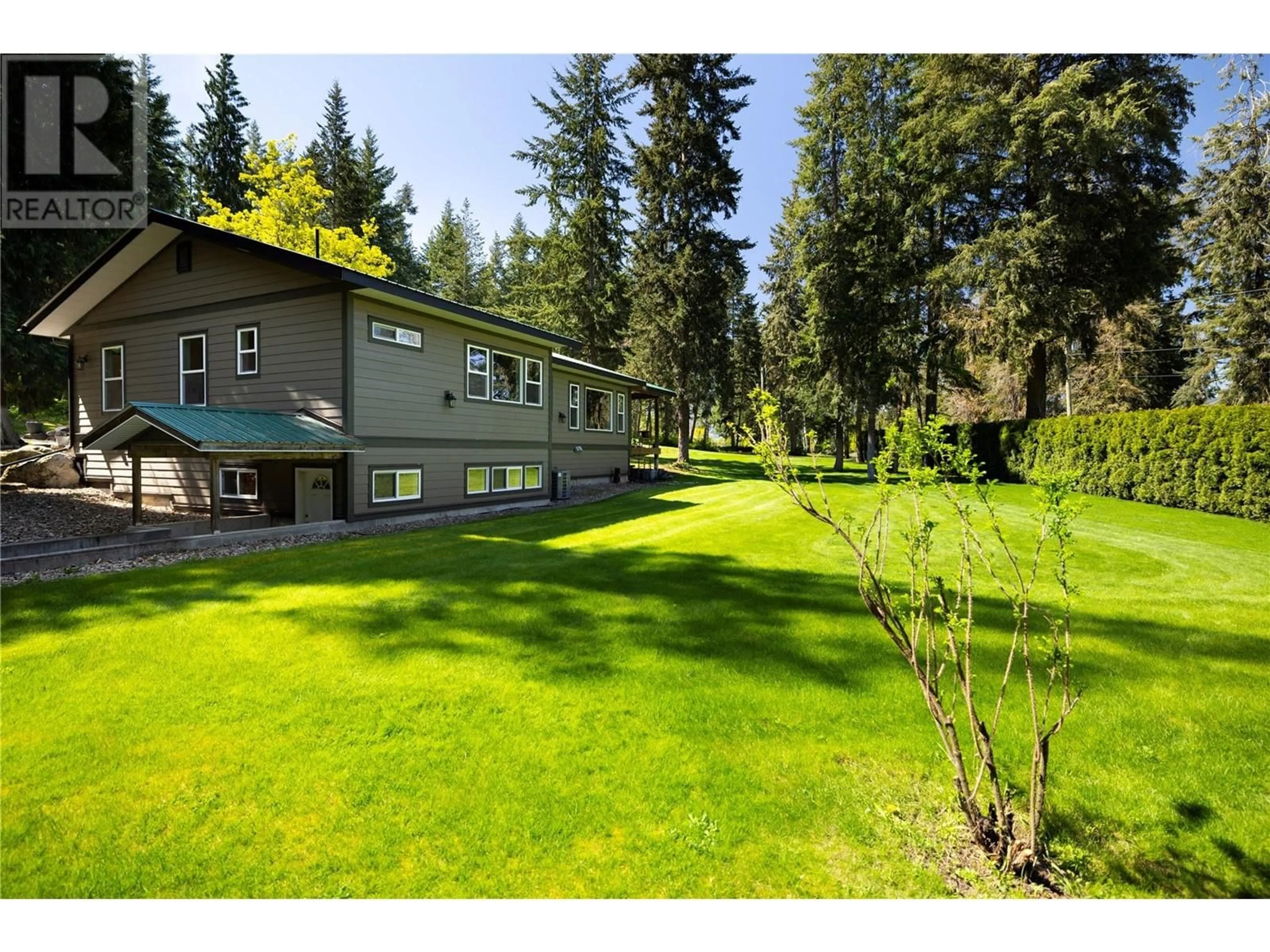 A pic from outside/outdoor area/front of a property/back of a property/a pic from drone, forest/trees view for 2350 POWERHOUSE ROAD, Armstrong British Columbia V0E1B8