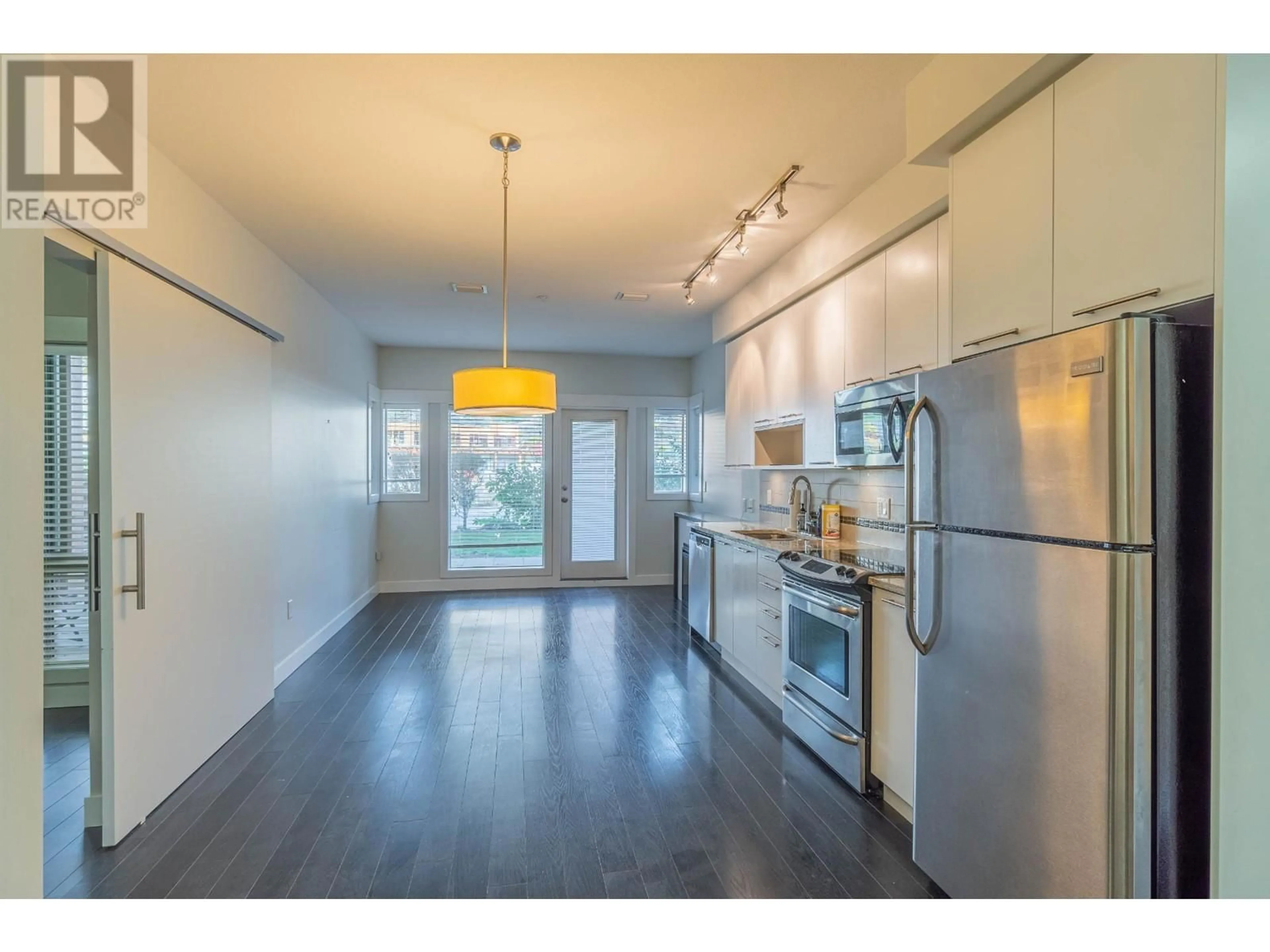Open concept kitchen, wood/laminate floor for 2107 - 1030 TALASA WAY, Kamloops British Columbia V2H0C3
