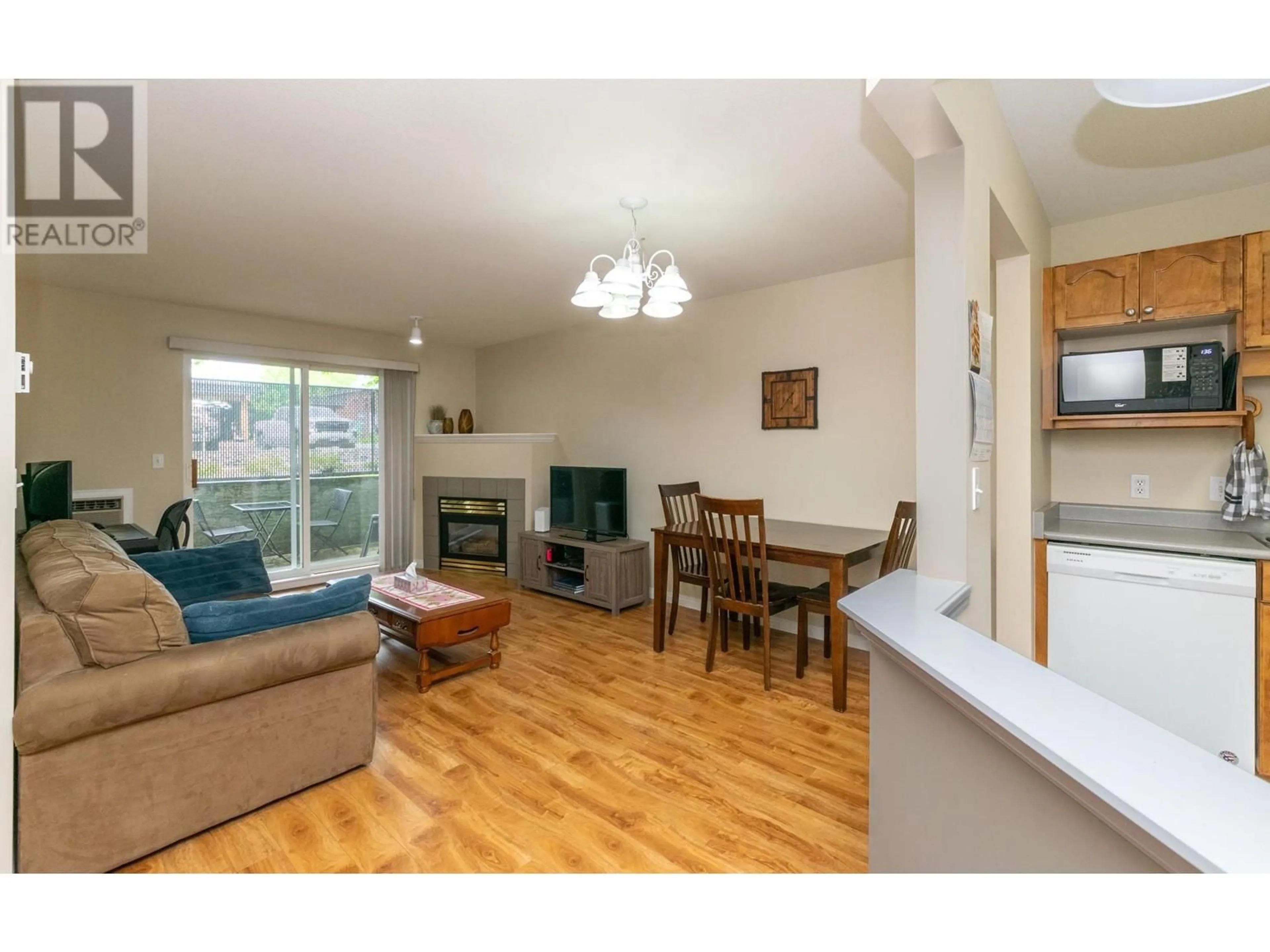 Living room with furniture, wood/laminate floor for 107 - 640 3 STREET SOUTHWEST, Salmon Arm British Columbia V1E2R3