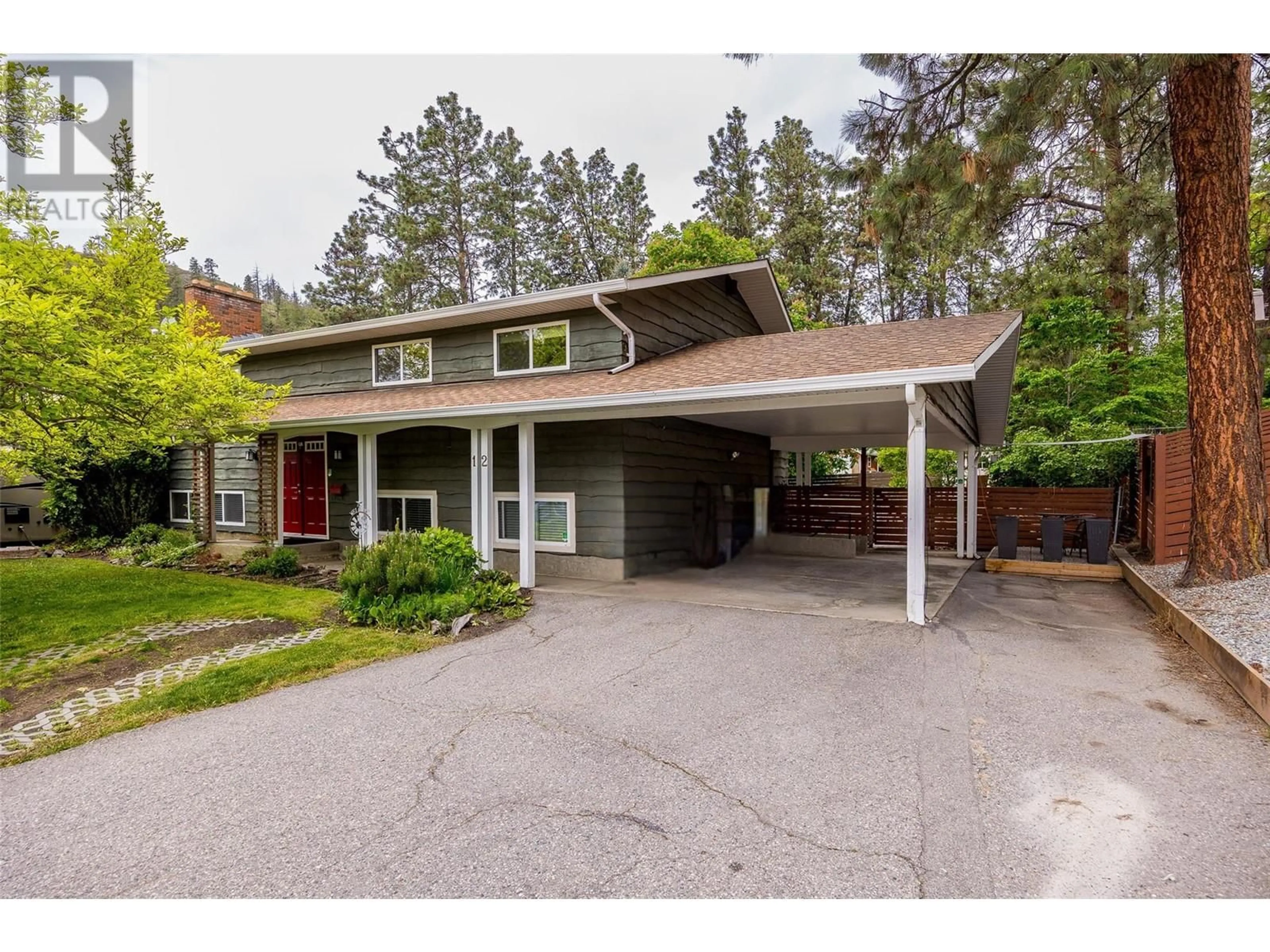Home with vinyl exterior material, street for 12 CARAMILLO ROAD, Kelowna British Columbia V1V1B1