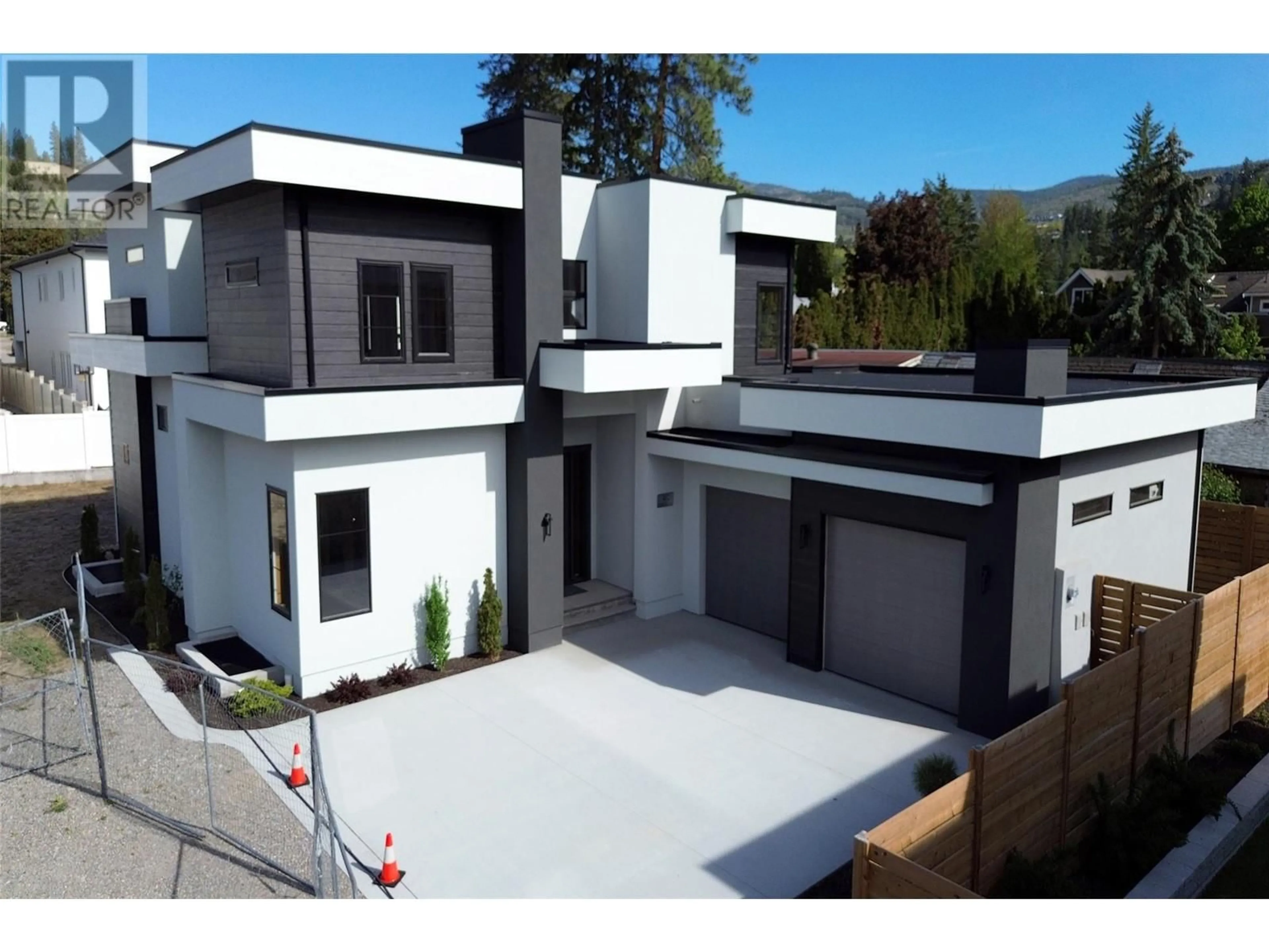 A pic from outside/outdoor area/front of a property/back of a property/a pic from drone, street for 4621 FORDHAM ROAD, Kelowna British Columbia V1W1P1