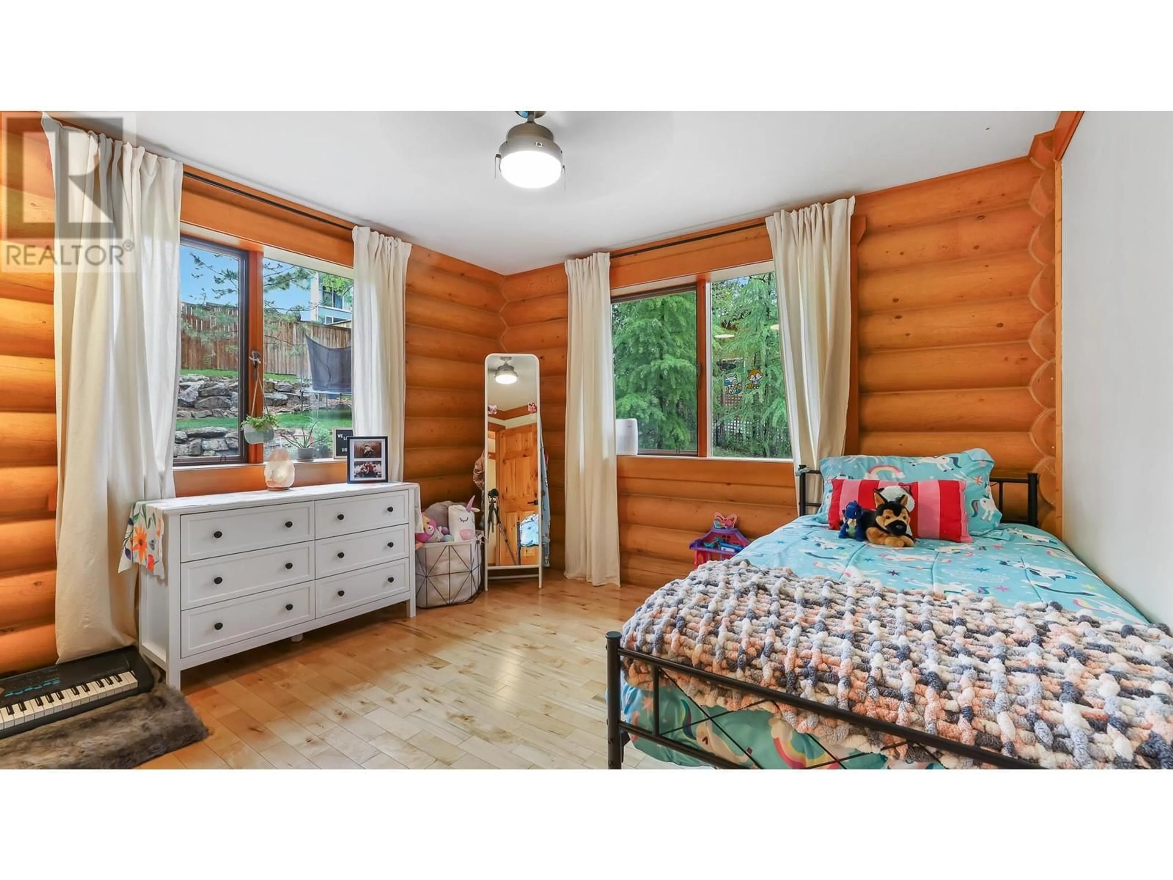 Bedroom with bed, wood/laminate floor for 1602 11TH AVENUE, Invermere British Columbia V0A1K4