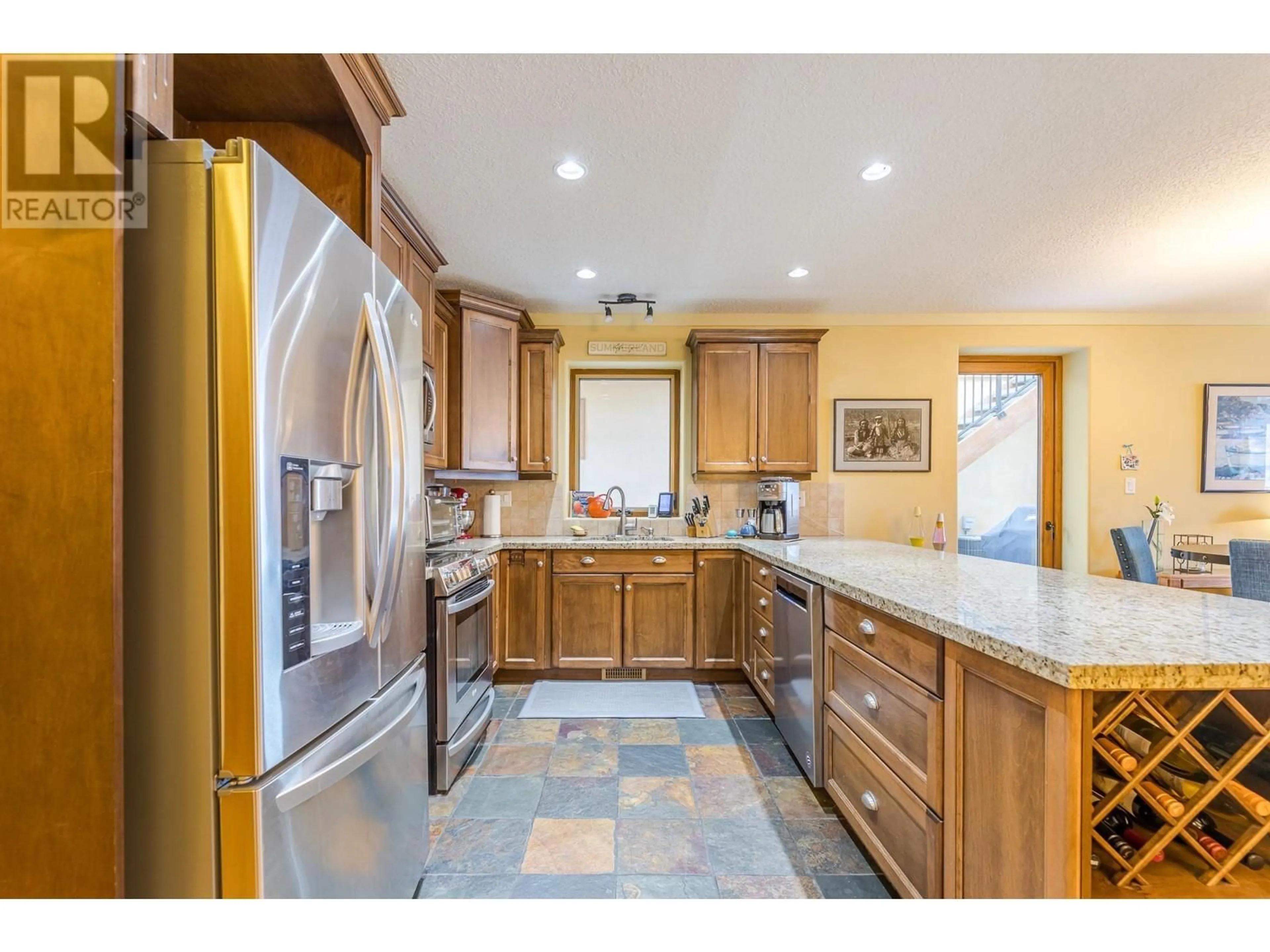 Open concept kitchen, ceramic/tile floor for 102 - 14611 DOWNTON AVENUE, Summerland British Columbia V0H1Z1