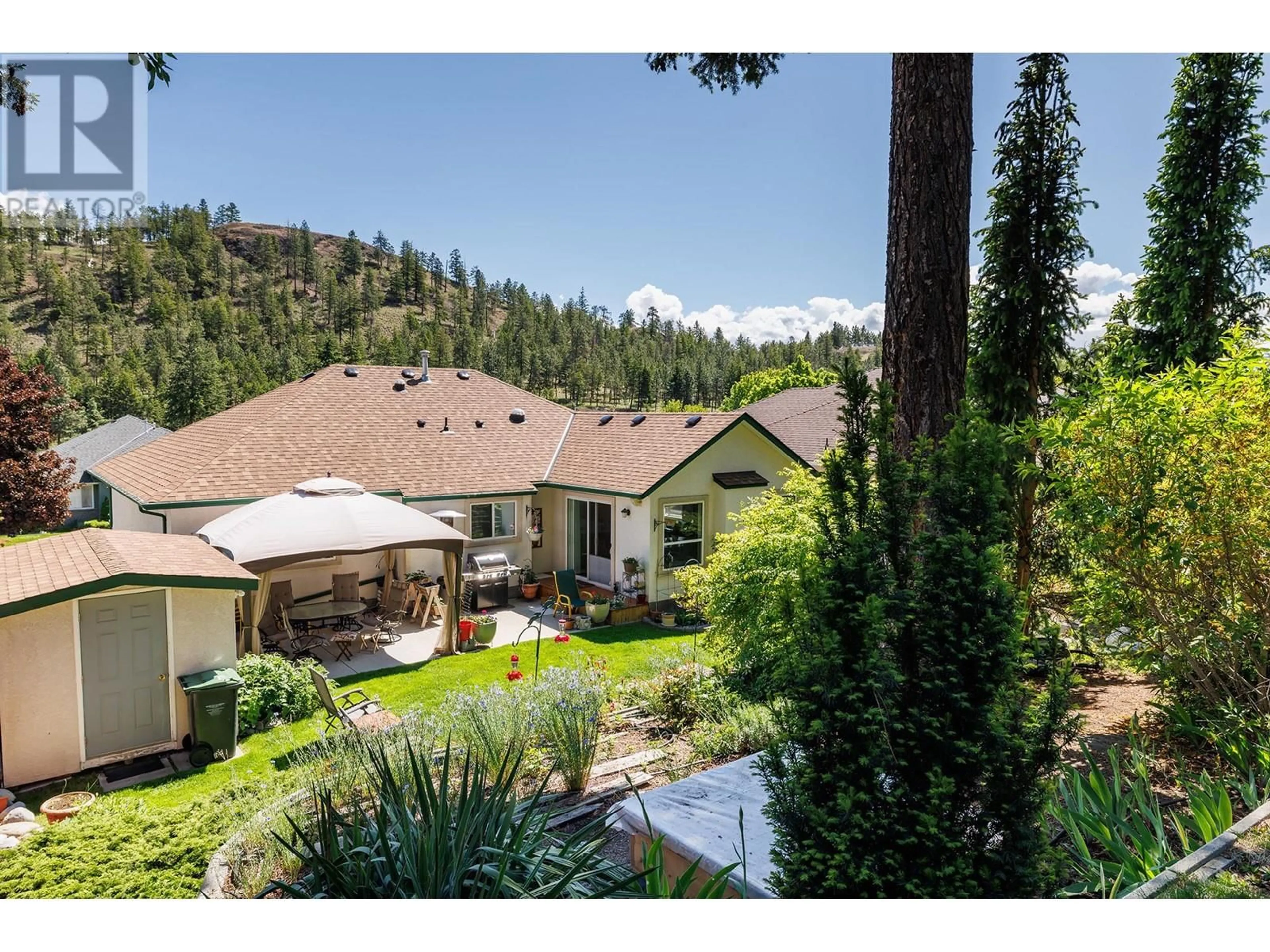 A pic from outside/outdoor area/front of a property/back of a property/a pic from drone, mountain view for 356 WOODPARK CRESCENT, Kelowna British Columbia V1V2L4
