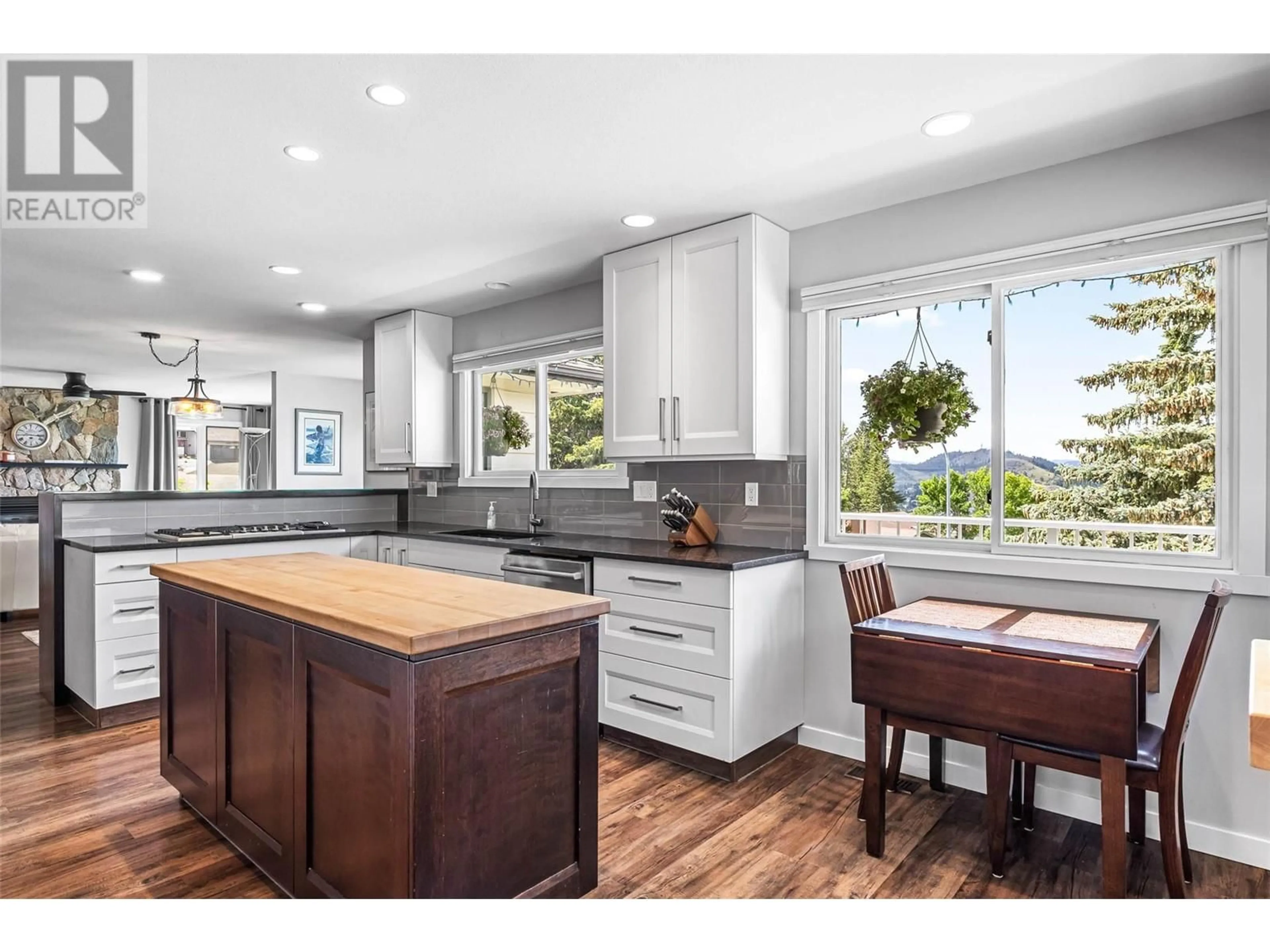Open concept kitchen, wood/laminate floor for 2091 HOLYROOD PLACE, Kamloops British Columbia V1S1E7
