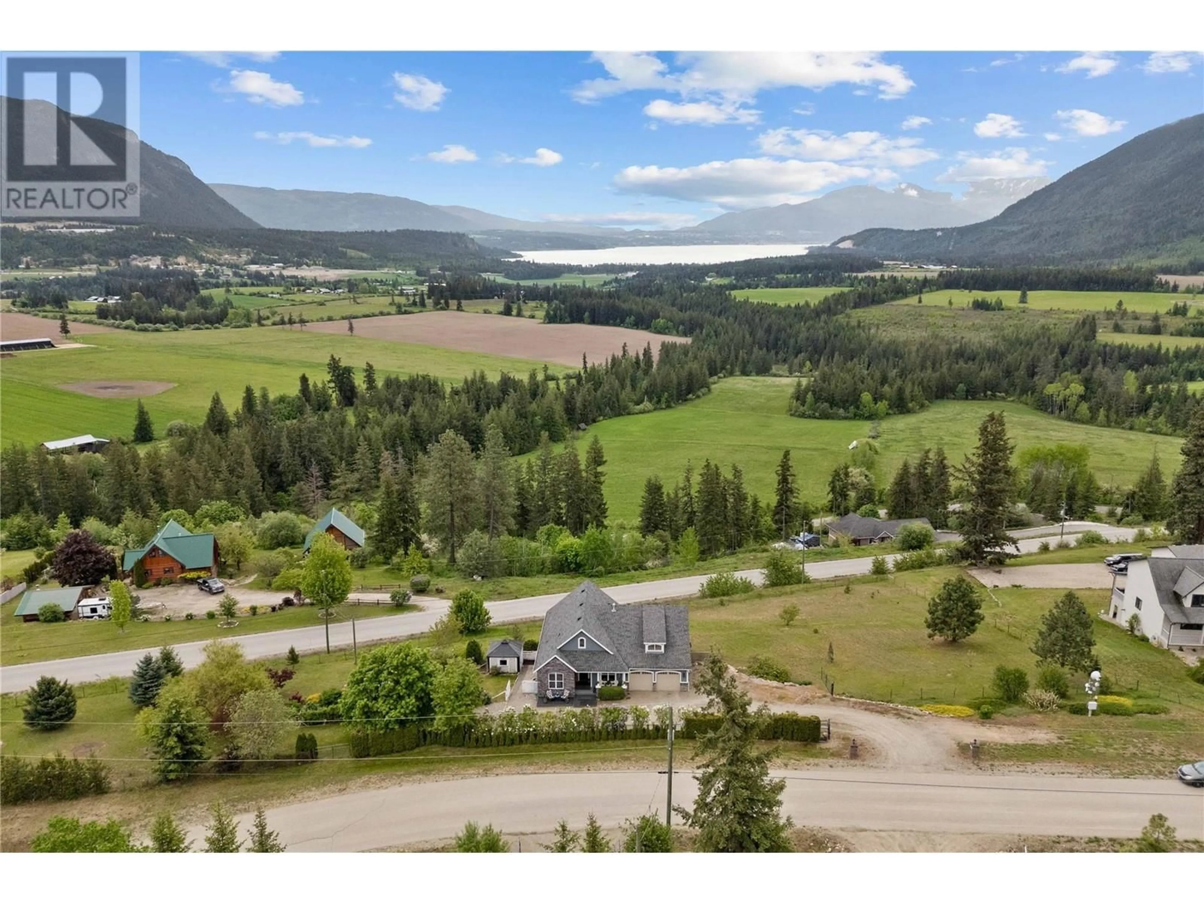 A pic from outside/outdoor area/front of a property/back of a property/a pic from drone, mountain view for 2754 SUN RIDGE PLACE, Tappen British Columbia V0E2X0