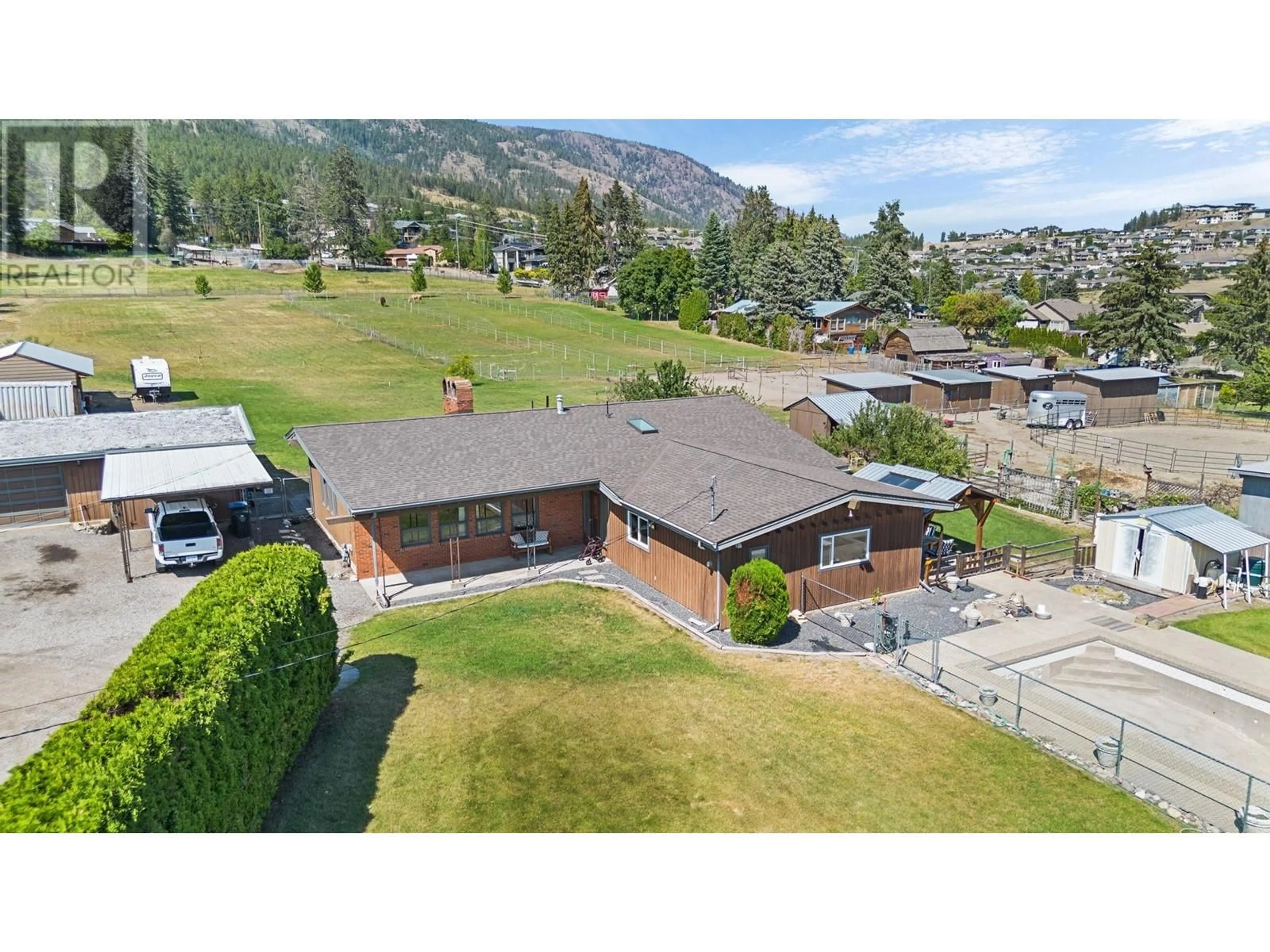 A pic from outside/outdoor area/front of a property/back of a property/a pic from drone, mountain view for 3131 ELLIOTT ROAD, West Kelowna British Columbia V4T1M7
